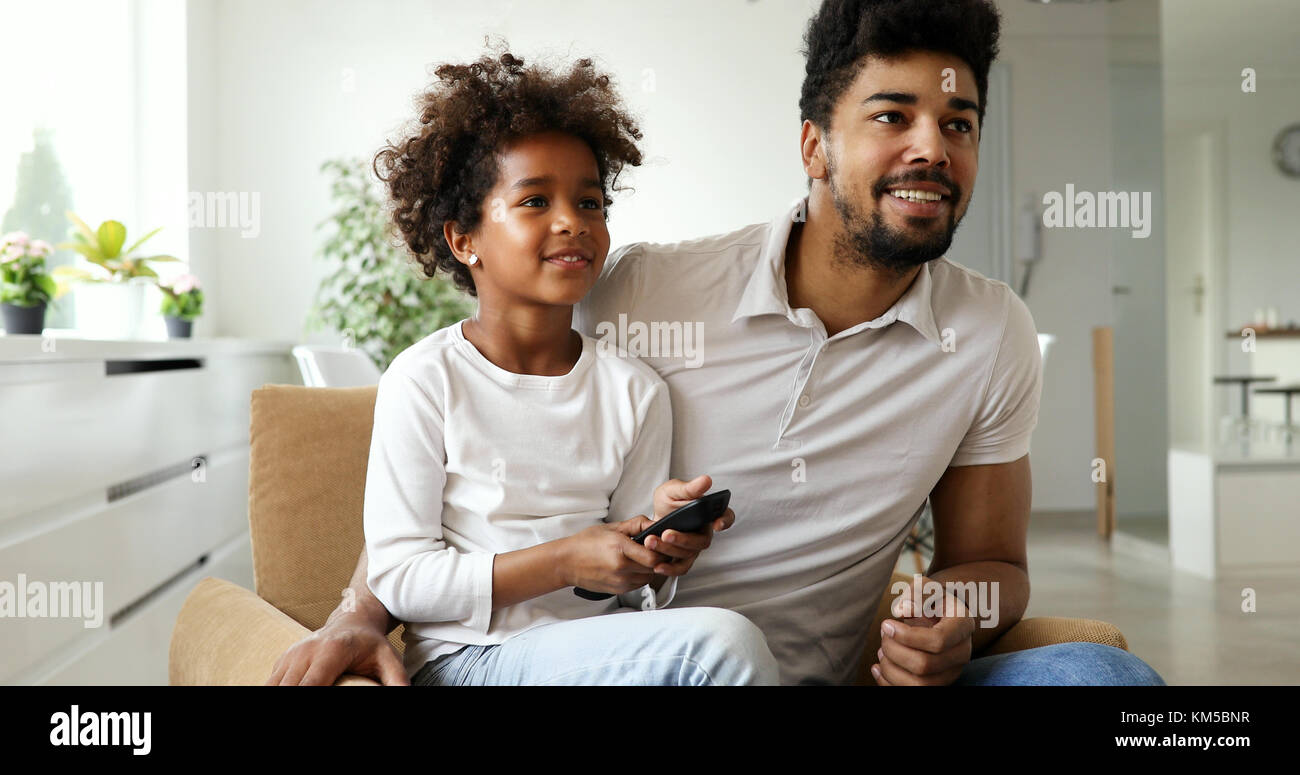 Relaxed african american family watching tv Stock Photo