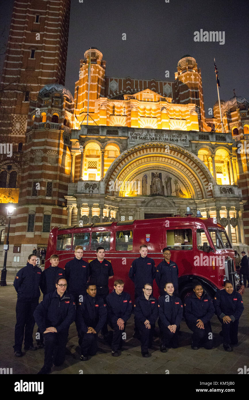 London, UK. 4th Dec, 2017. London Fire Brigade cadets and staff wearing period uniform stand in front of the 1954 Merryweather Emergency Tender vintage fire engine outside Westminster Cathedral prior to the arrival of Prince Harry to attend the London Fire Brigade carol service. The annual service features festive readings and traditional Christmas carols for London Fire Brigade's uniformed and non-uniformed members of staff and their families as well as retired ex-colleagues. Credit: Mark Kerrison/Alamy Live News Stock Photo