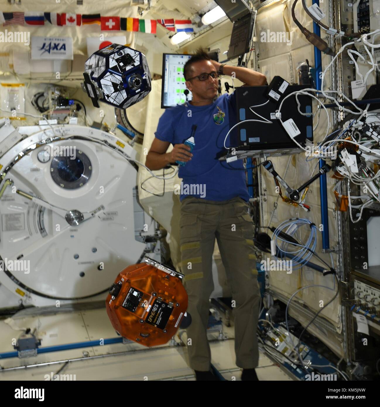 International Space Station, Earth Orbit. 04th Dec, 2017. Expedition 53 American astronaut Joe Acaba during a test of the Zero Robotics student project aboard the International Space Station December 4, 2017 in Earth Orbit. Zero Robotics is a robotics programming competition for High School and Middle School students using SPHERES satellites inside the International Space Station. Credit: Planetpix/Alamy Live News Stock Photo