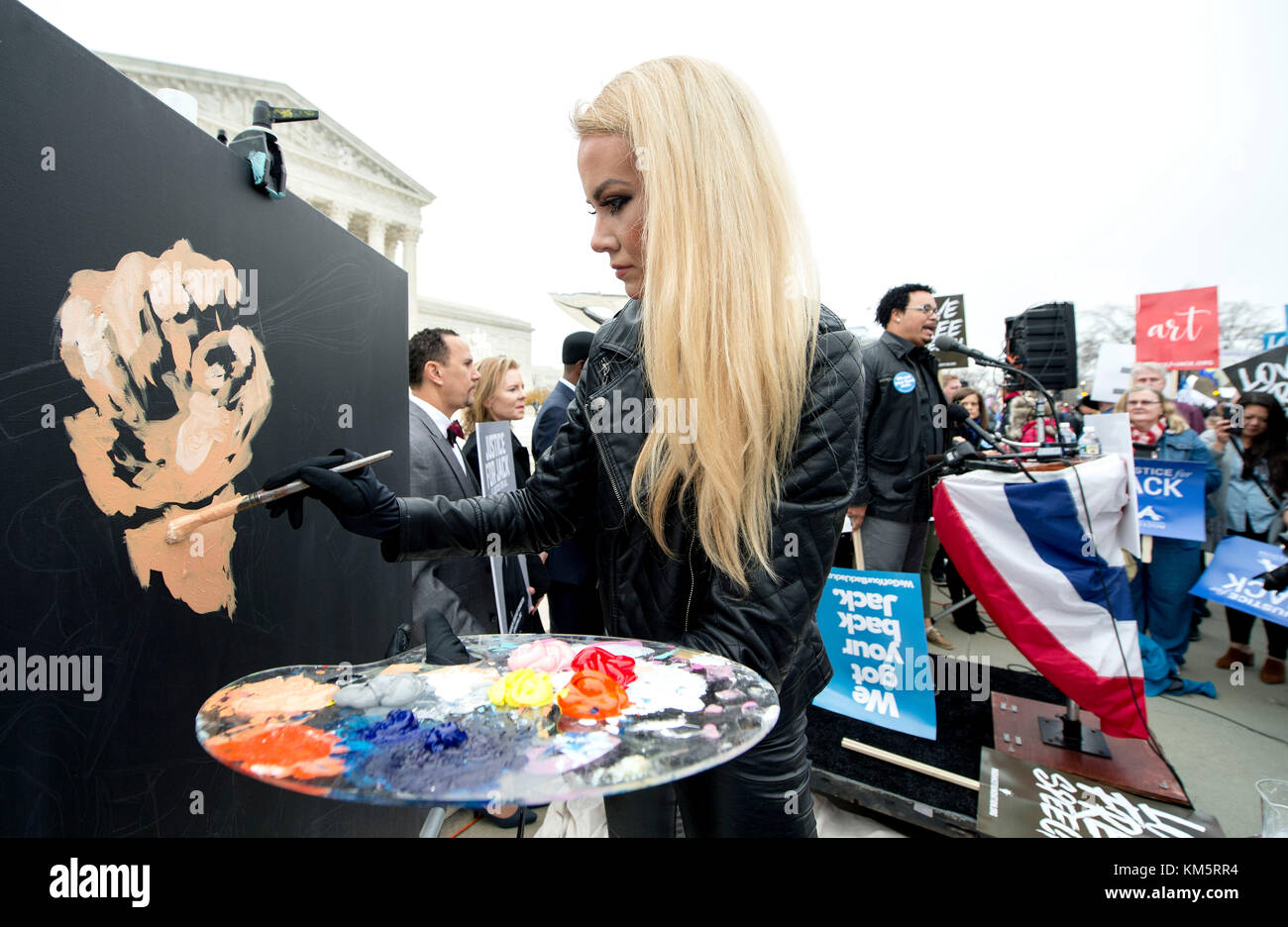 Washington, DC, USA. 05th Dec, 2017. JESSICA K. HAAS, a Christian-themed speed painter who won ABC's The Gong Show, paints outside the United States Supreme Court on the morning of oral arguments in the Masterpiece Cakeshop v. Colorado Civil Rights Commission. The case pits a Lakewood, Colorado cake artist, Jack Phillips, who refused to make a wedding cake for a gay couple on religious grounds, against the public accomodation laws which bar discrimination. Credit: Brian Cahn/ZUMA Wire/Alamy Live News Stock Photo