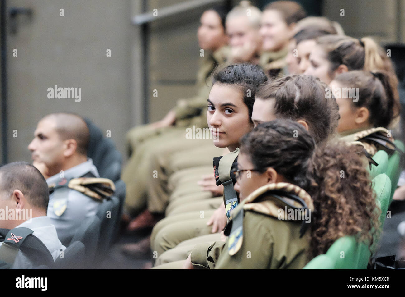 Latrun, Israel. 5th Dec, 2017. 13 female IDF soldiers graduate tank crew training at a ceremony at Yad LaShiryon, the Armored Corps Memorial Site at Latrun. These are the first women to serve in the Armored Corps as part of a pilot program. Having concluded tank training on Merkava Mark 3 tanks, female soldiers are destined to serve in the army's 80th Division, responsible for the southern Negev and Arava deserts, securing Israel's borders with Egypt and Jordan. Credit: Nir Alon/Alamy Live News Stock Photo