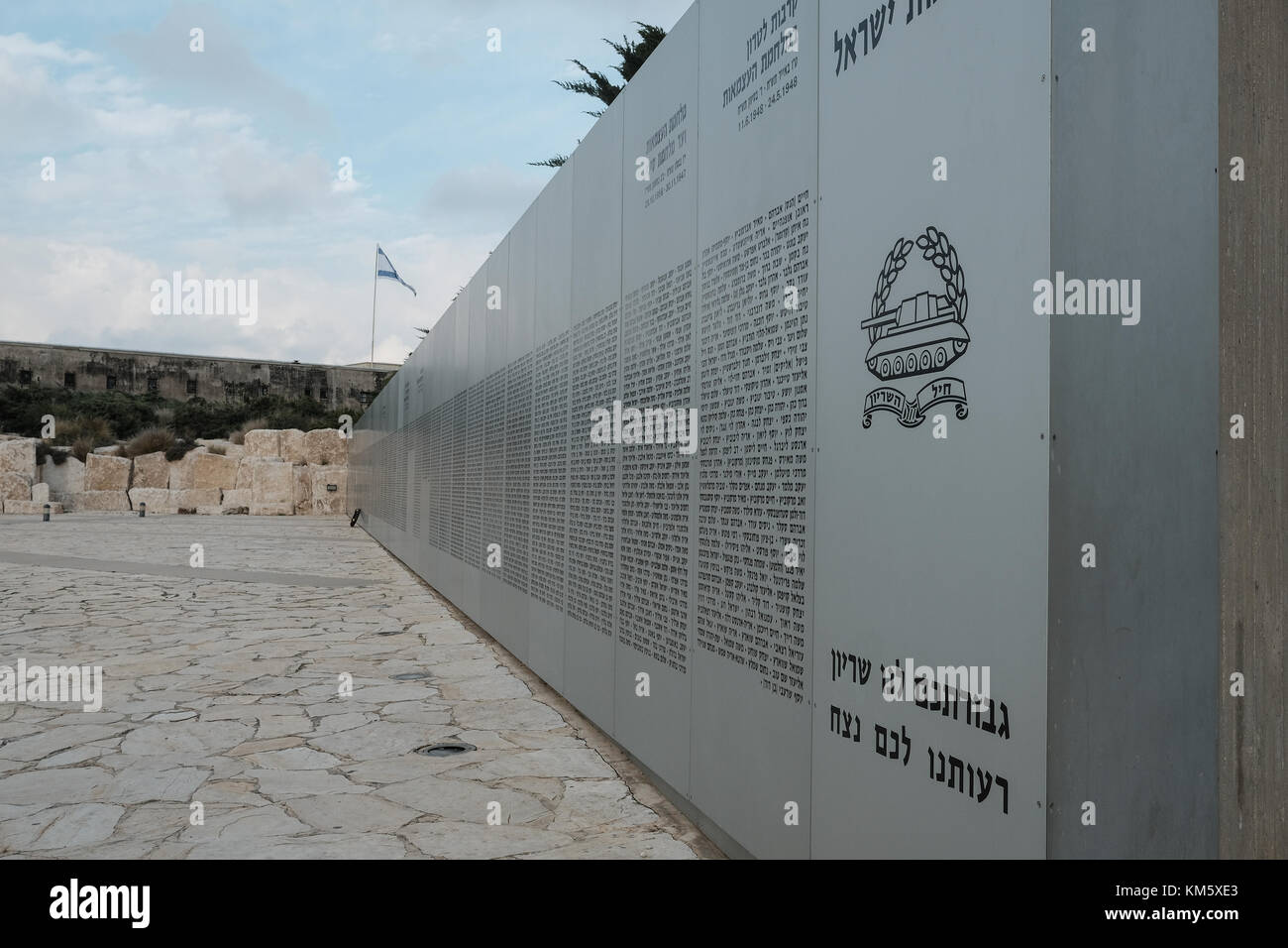Latrun, Israel. 5th Dec, 2017. A memorial wall details the names of fallen soldiers as 13 female IDF soldiers graduate tank crew training at a ceremony at Yad LaShiryon, the Armored Corps Memorial Site at Latrun. These are the first women to serve in the Armored Corps as part of a pilot program. Having concluded tank training on Merkava Mark 3 tanks, female soldiers are destined to serve in the army's 80th Division, responsible for the southern Negev and Arava deserts, securing Israel's borders with Egypt and Jordan. Credit: Nir Alon/Alamy Live News Stock Photo