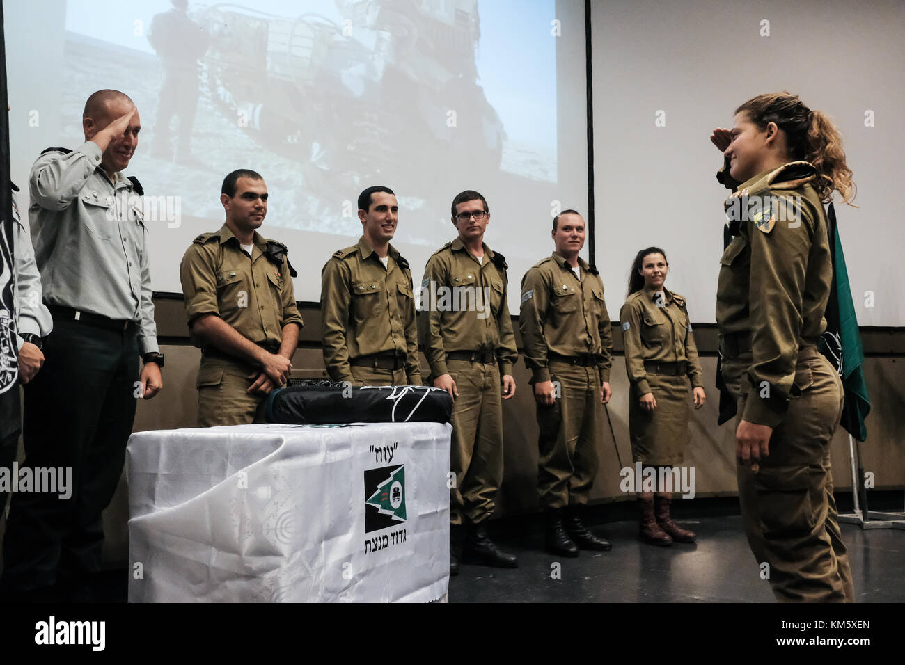 Latrun, Israel. 5th Dec, 2017. 13 female IDF soldiers graduate tank crew training at a ceremony at Yad LaShiryon, the Armored Corps Memorial Site at Latrun. These are the first women to serve in the Armored Corps as part of a pilot program. Having concluded tank training on Merkava Mark 3 tanks, female soldiers are destined to serve in the army's 80th Division, responsible for the southern Negev and Arava deserts, securing Israel's borders with Egypt and Jordan. Credit: Nir Alon/Alamy Live News Stock Photo