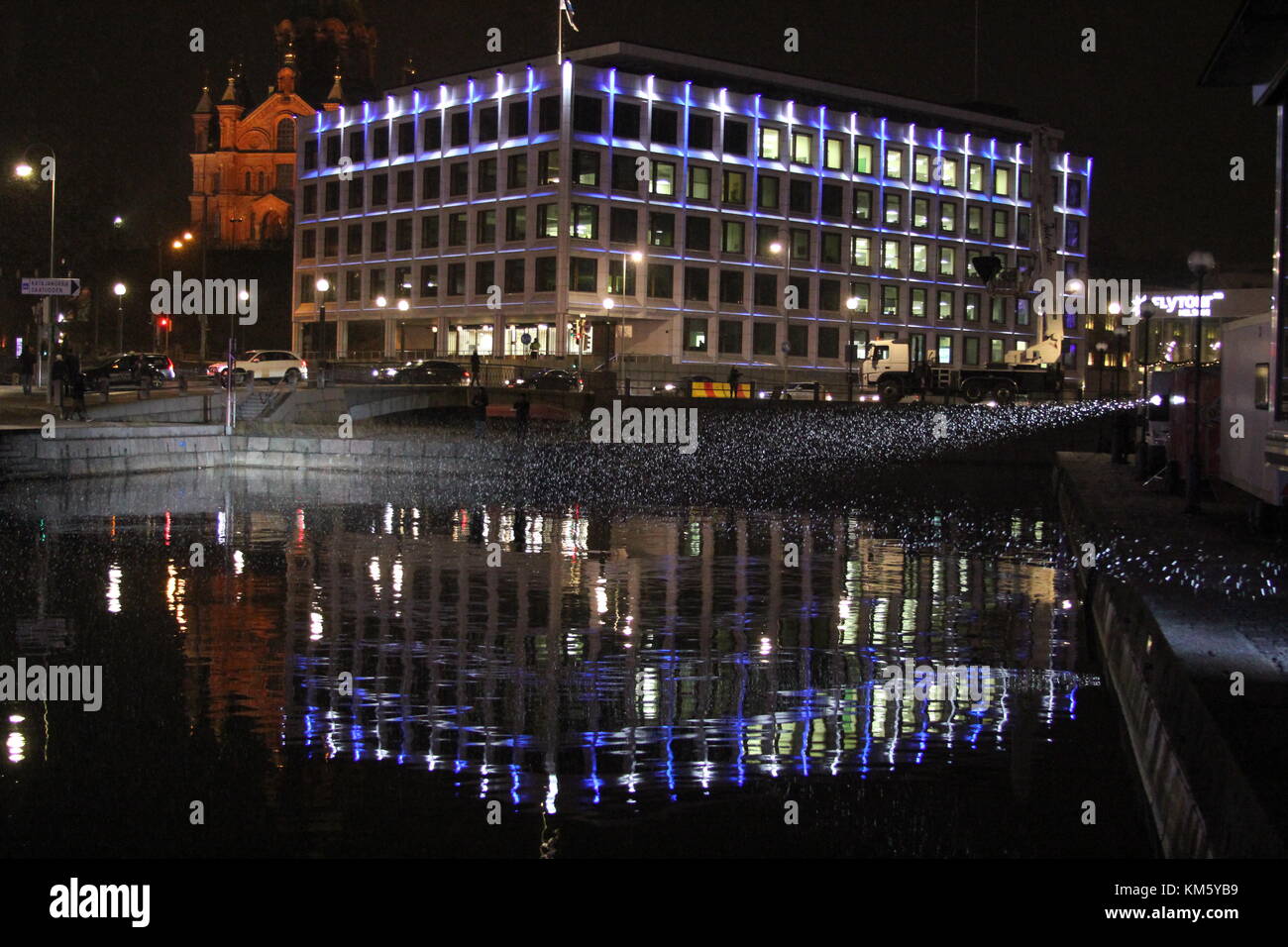 Kanavaranta, Helsinki, Finland. 5th Dec, 2017. Illumination of Stora Enso building by Alvar Aalto celebrates Finland's 100 years of independence on 6th December. Credit: Heini Kettunen/Alamy Live News Stock Photo