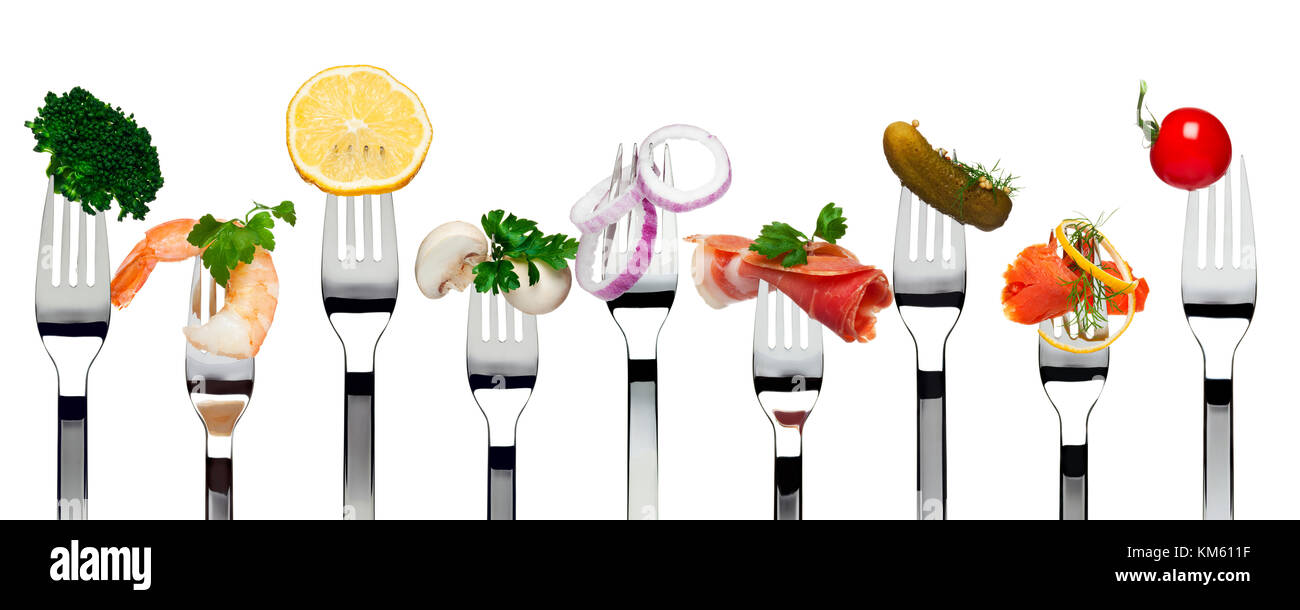 Variety of food on forks isolated Stock Photo Alamy