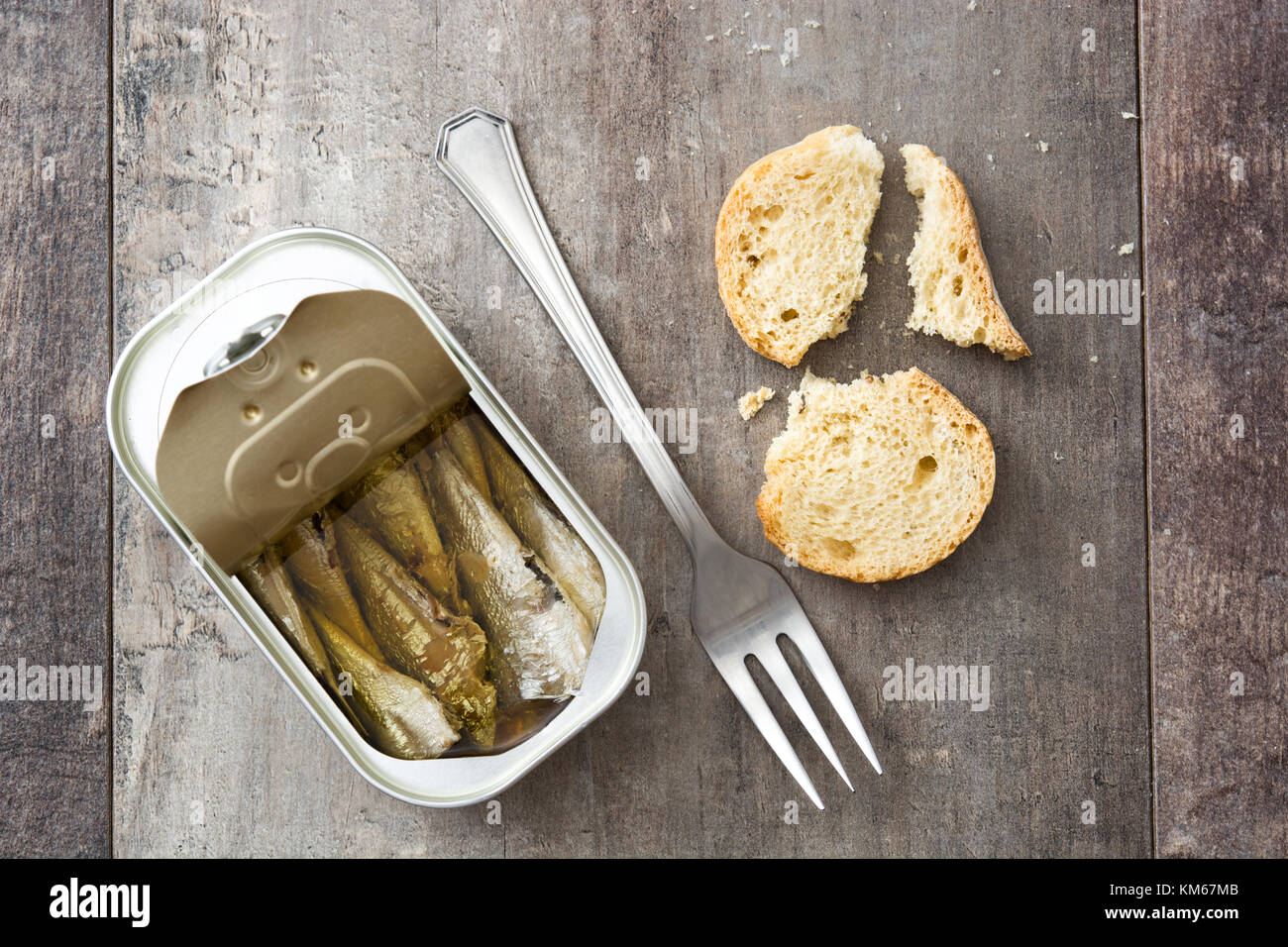 Sardines can preserve on wooden table Stock Photo Alamy