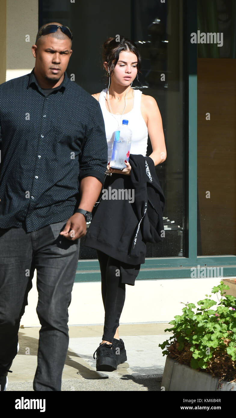 selena gomez gym A flushed looking Selena Gomez leaves a gym with damp hair after an intense  yoga session.