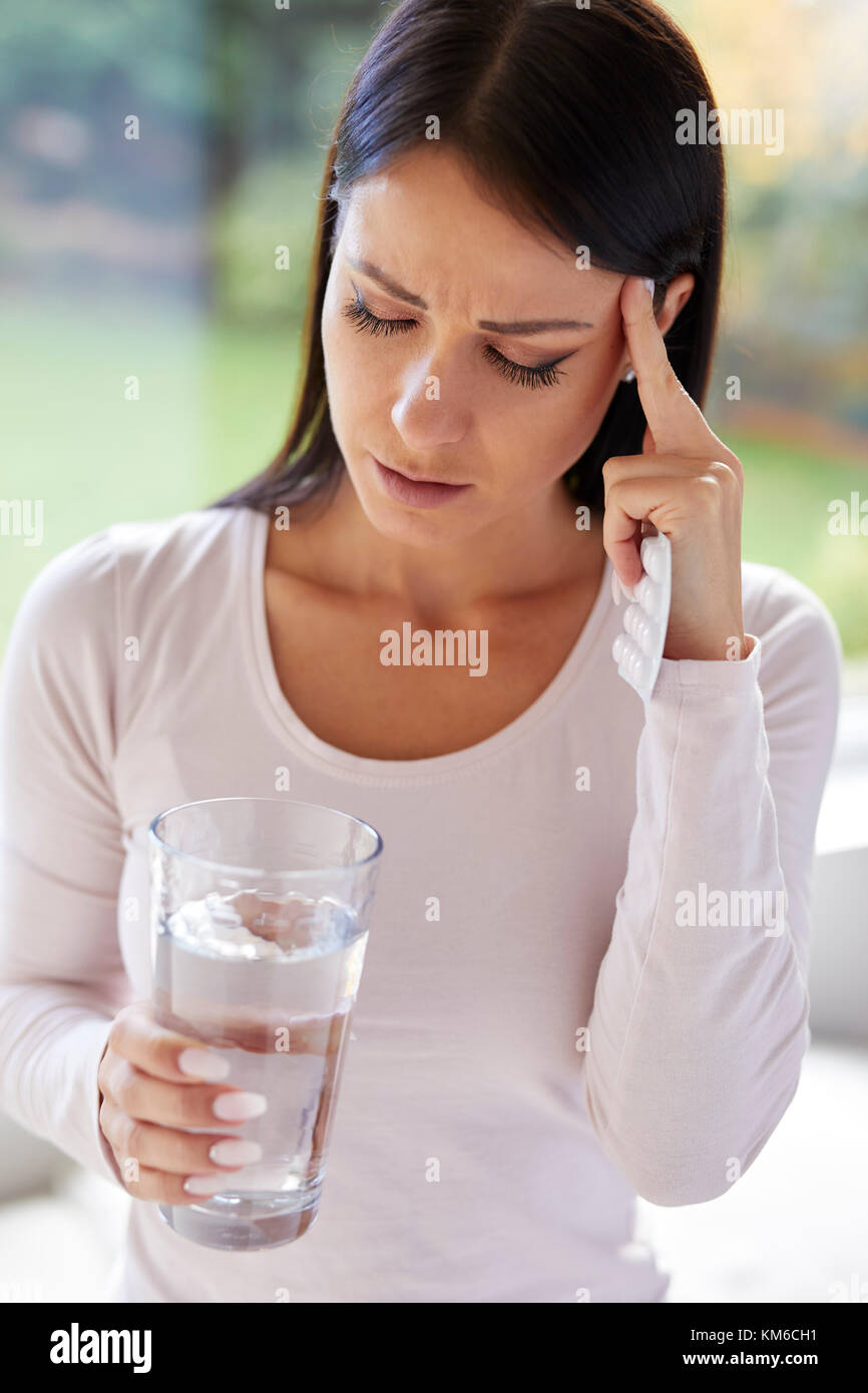 Woman holding packet of tablets Stock Photo