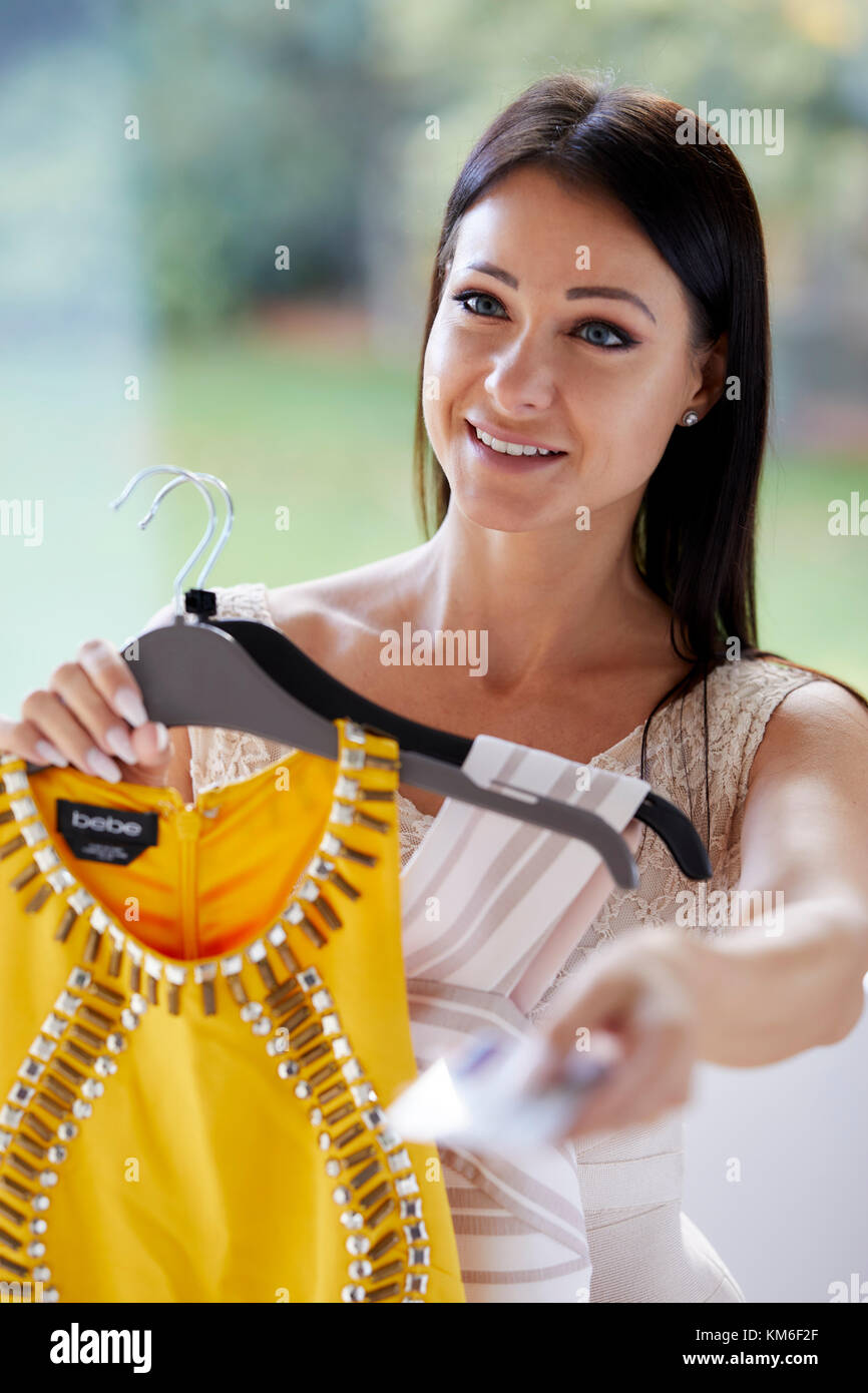 Girl paying for goods with credit card Stock Photo