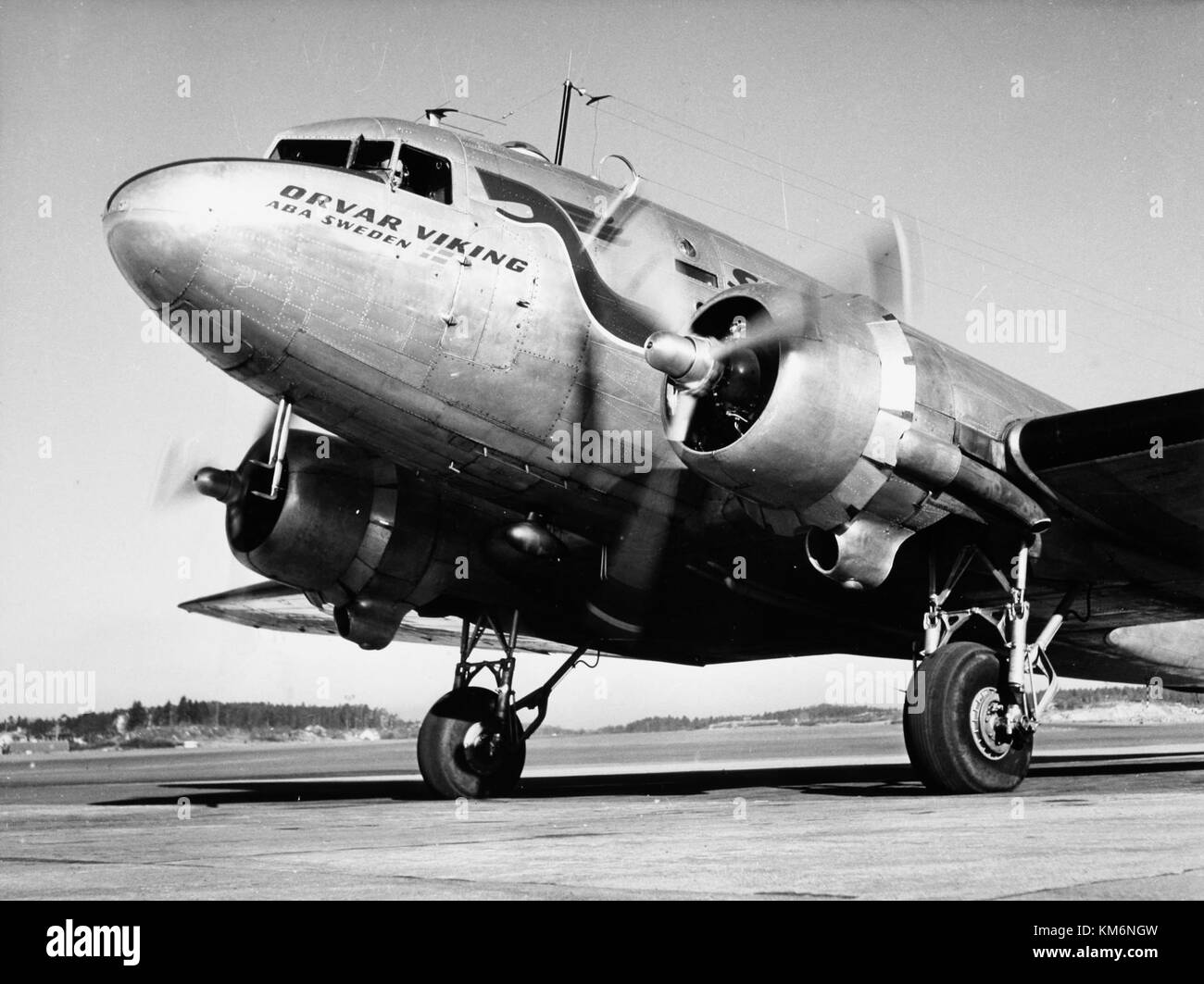 The SAS DC 3 Orvar Viking, with registration SE BBO, was a significant aircraft used by Scandinavian Airlines in the 1940s. The image shows it on the ground at an airport, showcasing early commercial aviation. Stock Photo