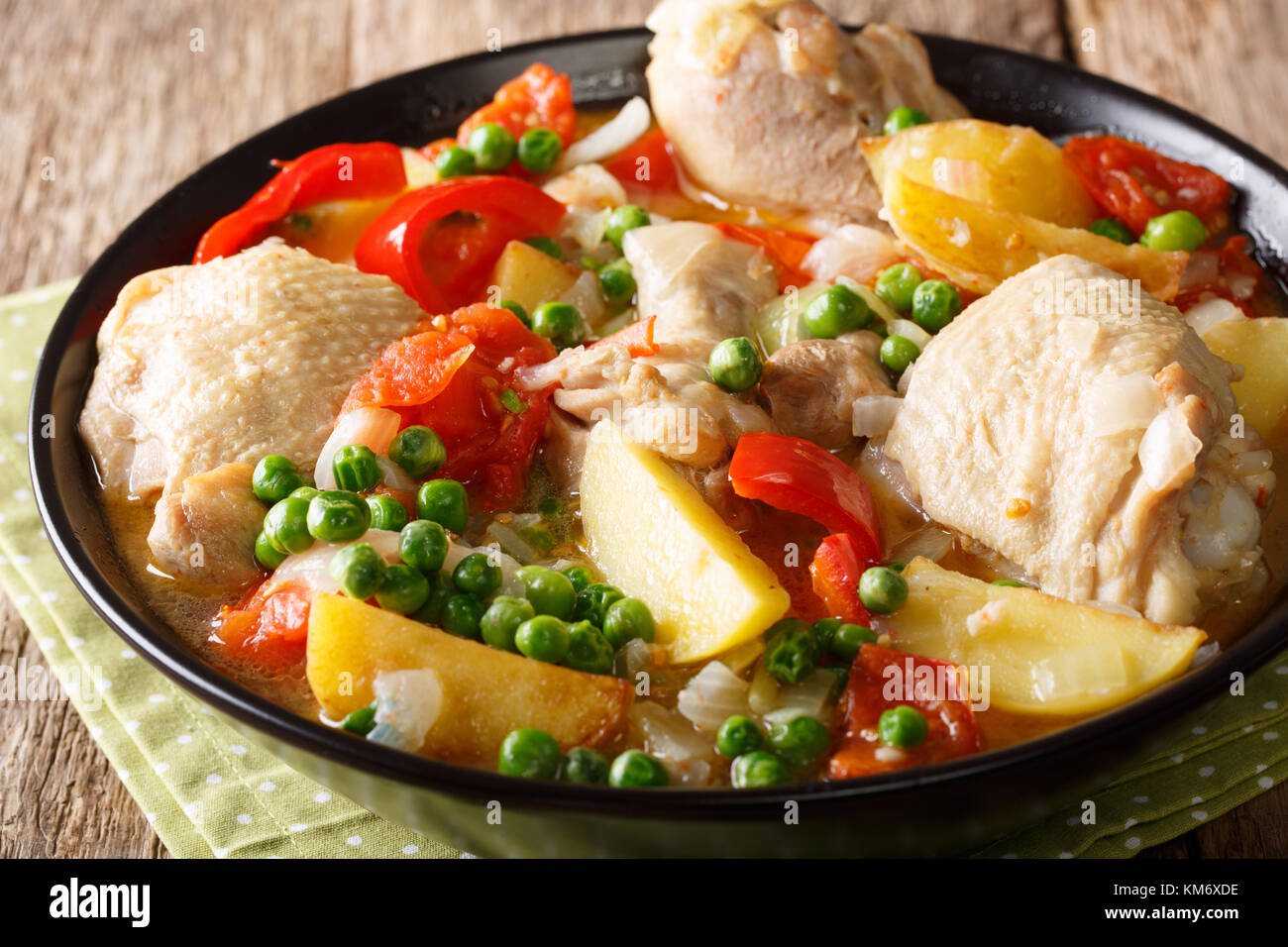 Filipino Afritada: slices of chicken with vegetables close-up in a bowl on the table. horizontal Stock Photo