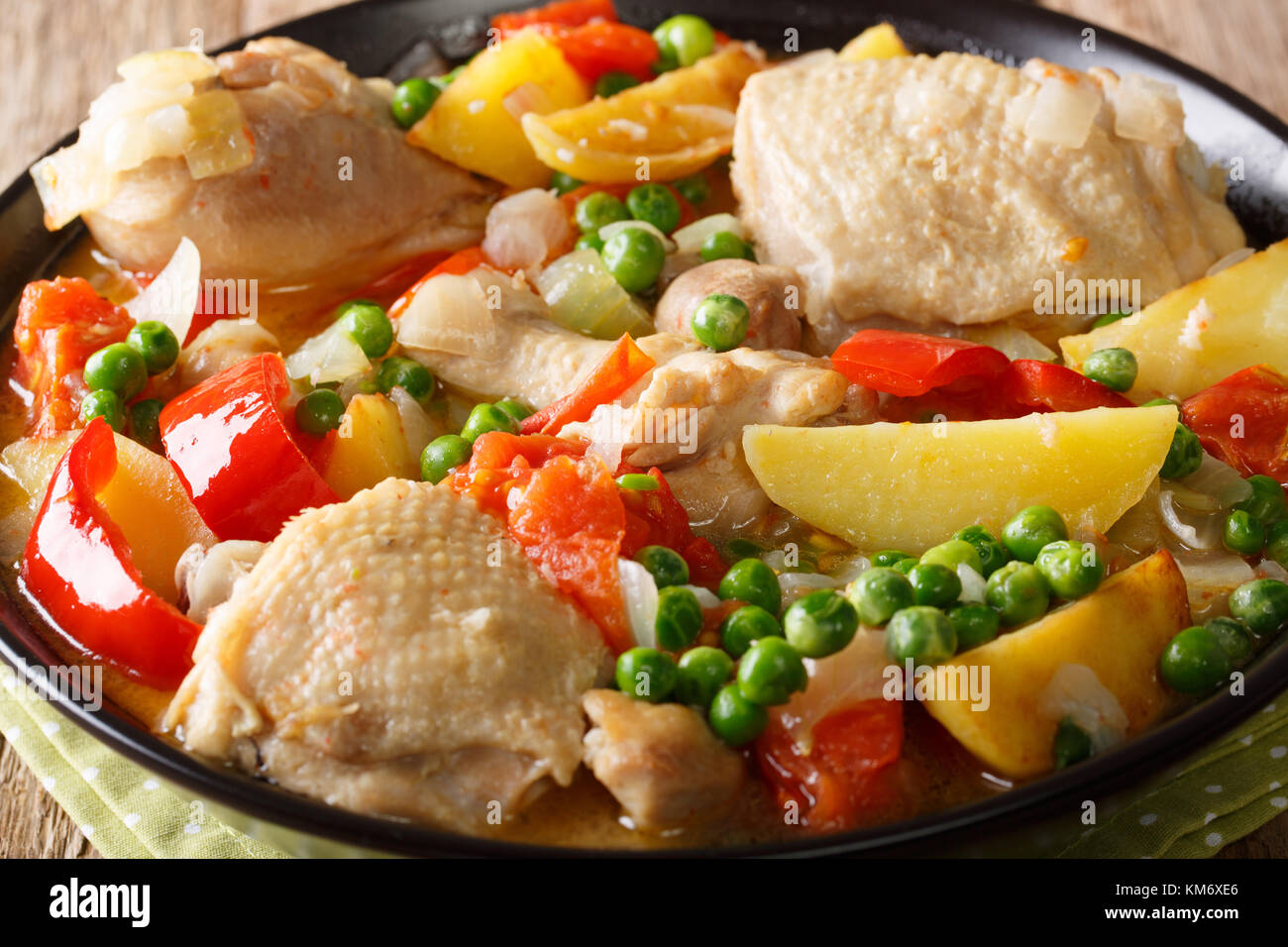 Philippine Food: Afritada Chicken with vegetables in a bowl close-up. horizontal Stock Photo