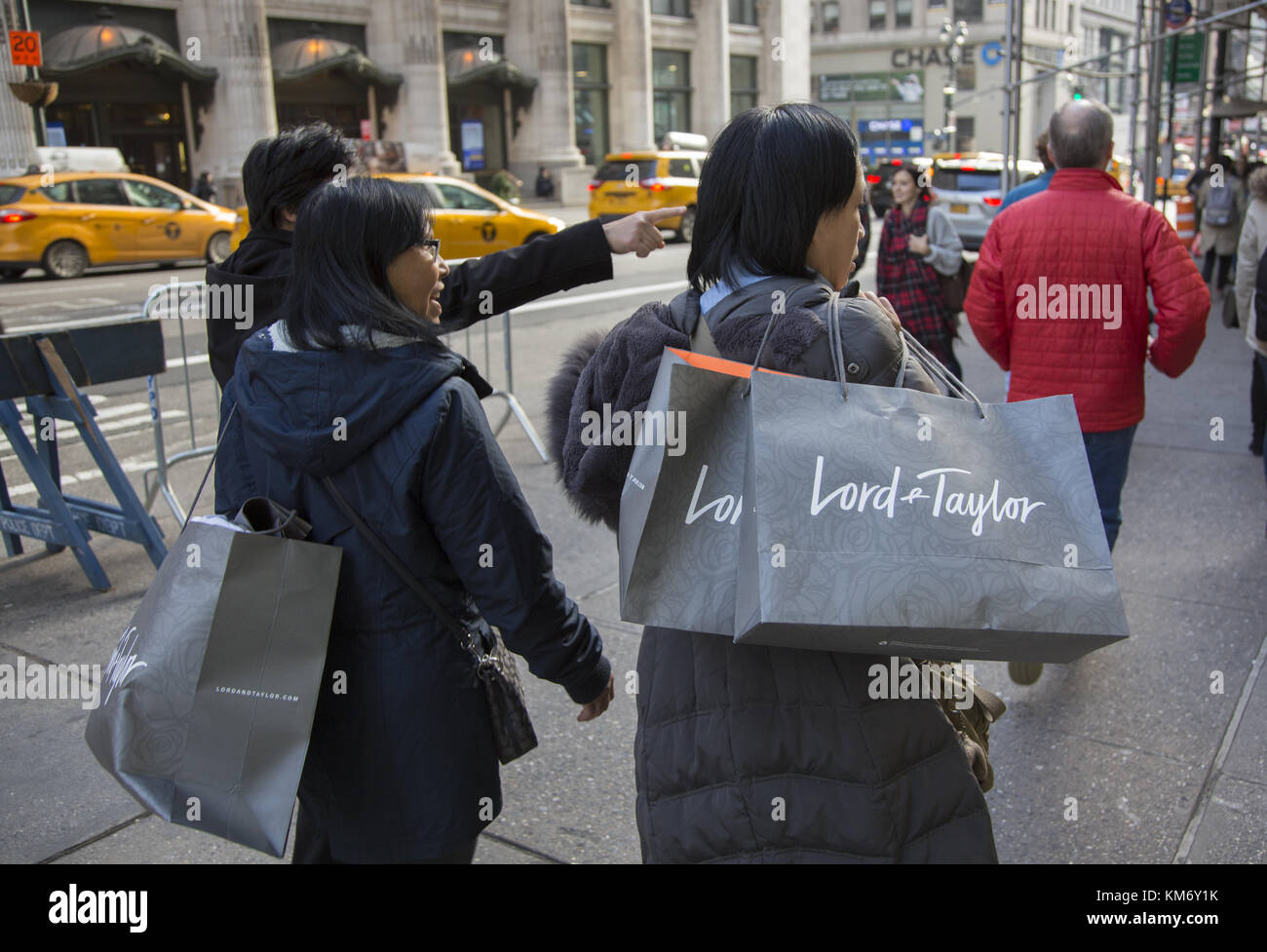 Holiday shoppers on the street in midtown Manhattan, New York City. Stock Photo