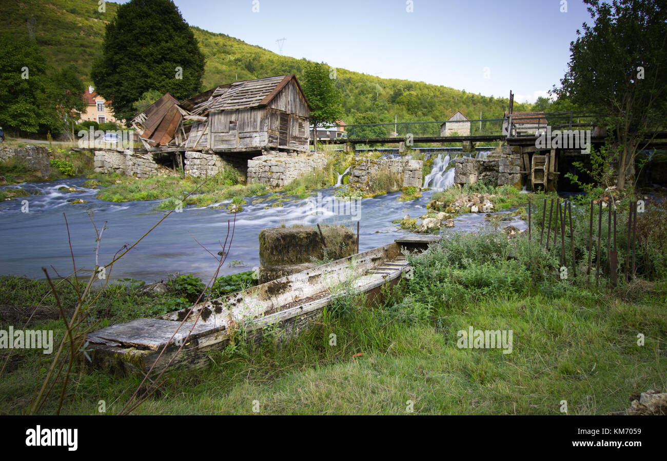 Old water mill with fast flowing water at the source of the River Gacka at Tonkovic Vrelo, Lika county near Otocac, Croatia Stock Photo