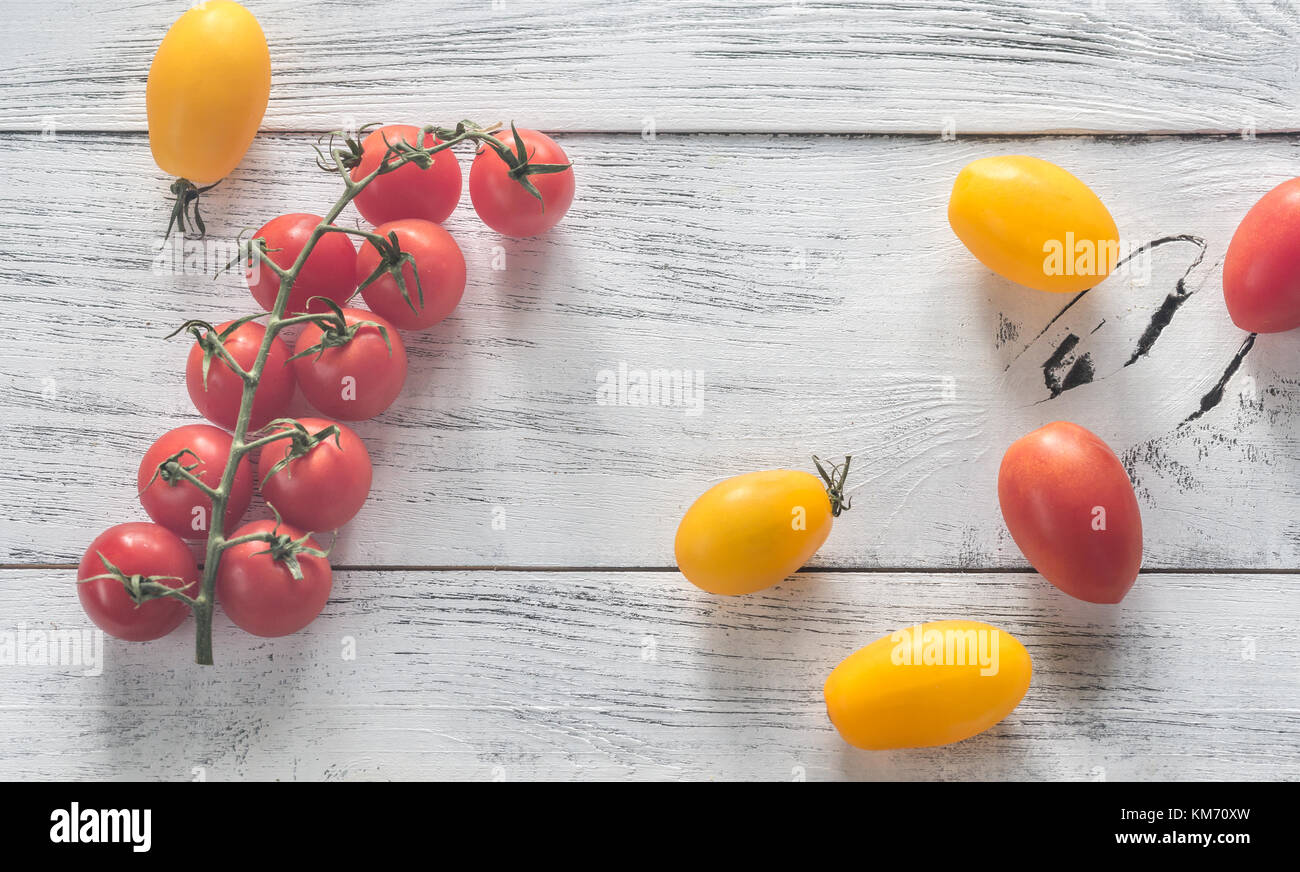Fresh tomatoes on the wooden background Stock Photo - Alamy