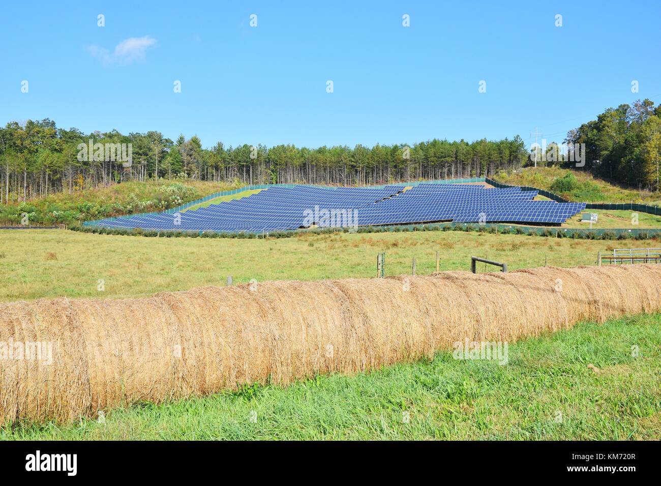 Green energy - photovoltaic solar panels in a rural field Stock Photo