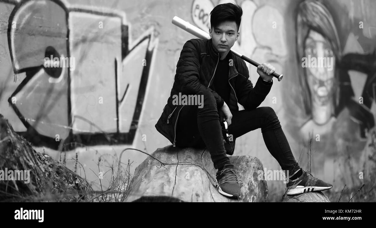 Black White photo of Asian young man outdoors posing Stock Photo - Alamy