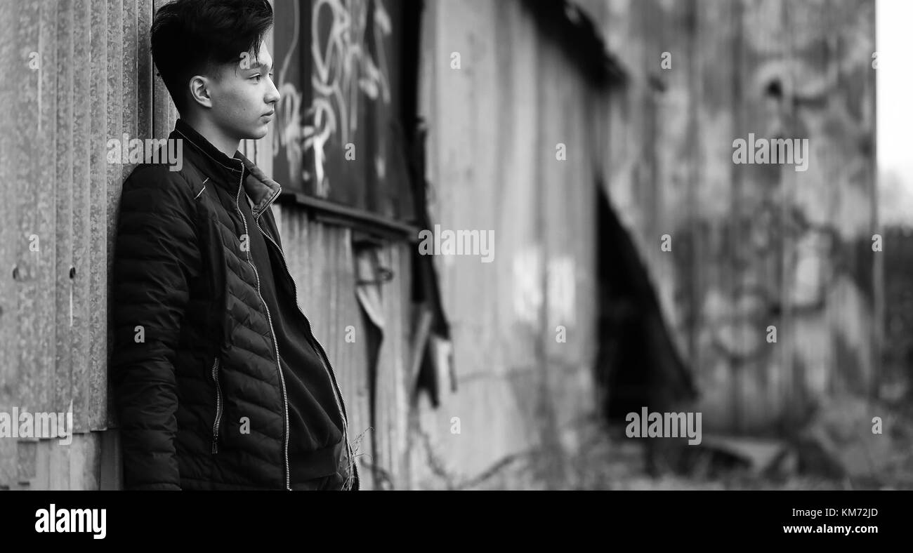 Black White photo of Asian young man outdoors posing Stock Photo - Alamy