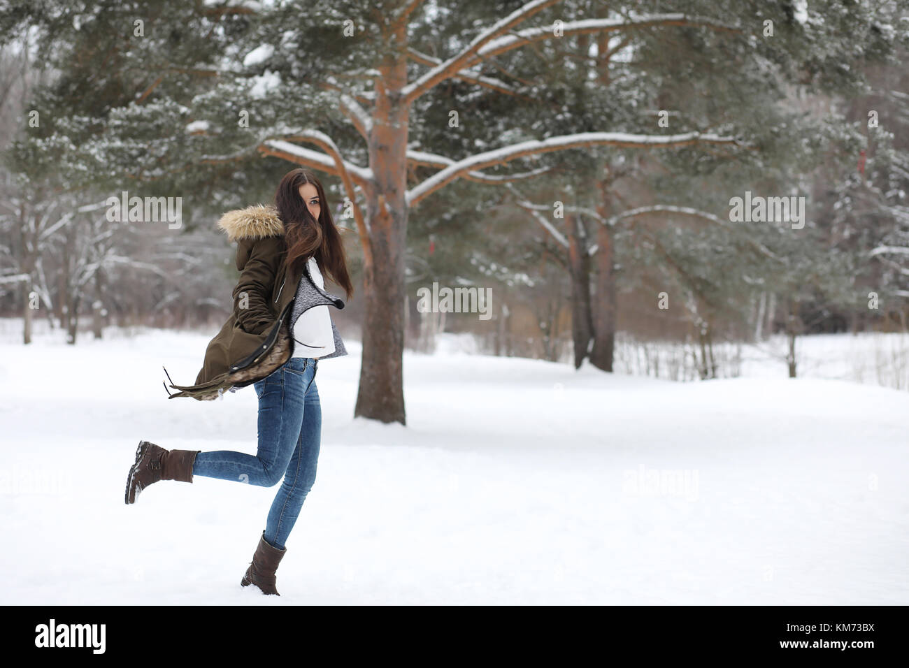 Beautiful girl in a beautiful winter park Stock Photo - Alamy