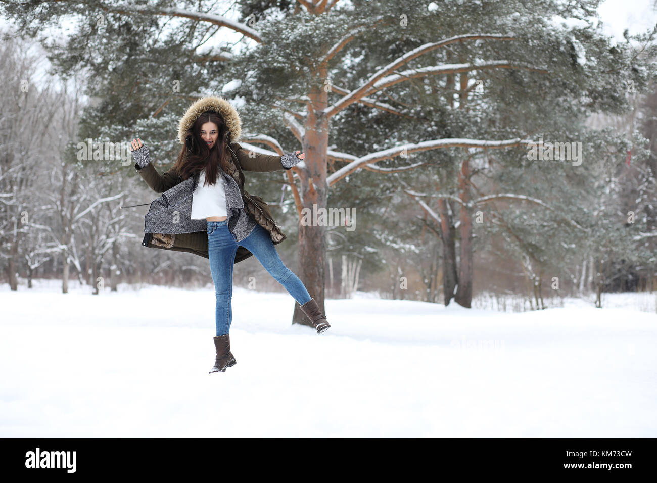 Beautiful girl in a beautiful winter park Stock Photo - Alamy
