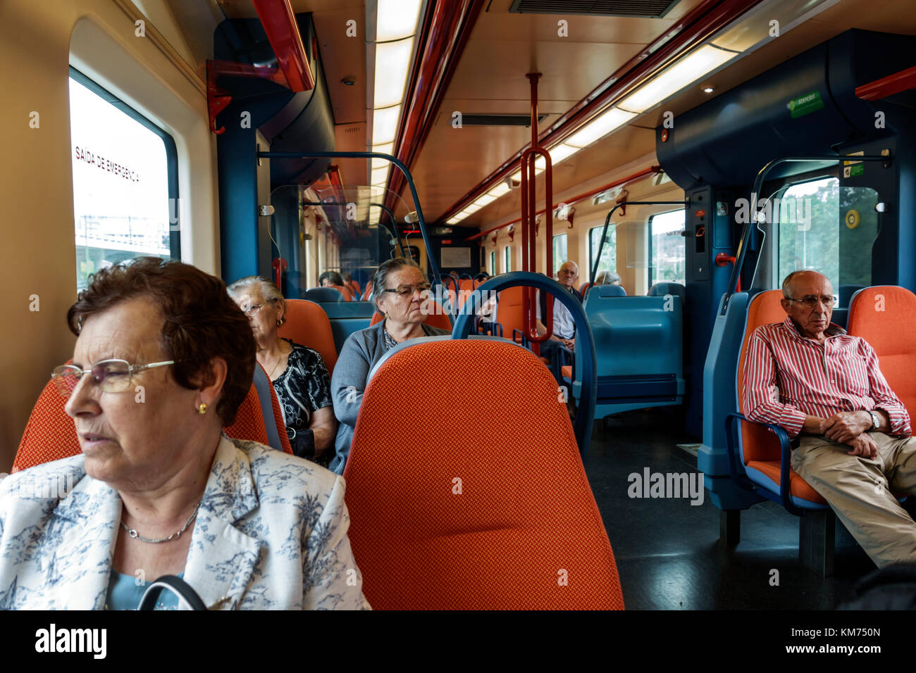 Coimbra Portugal,Comboios de Portugal,railway,local train,inside,seats,passenger rider,woman female women,man men male,senior seniors citizen citizens Stock Photo