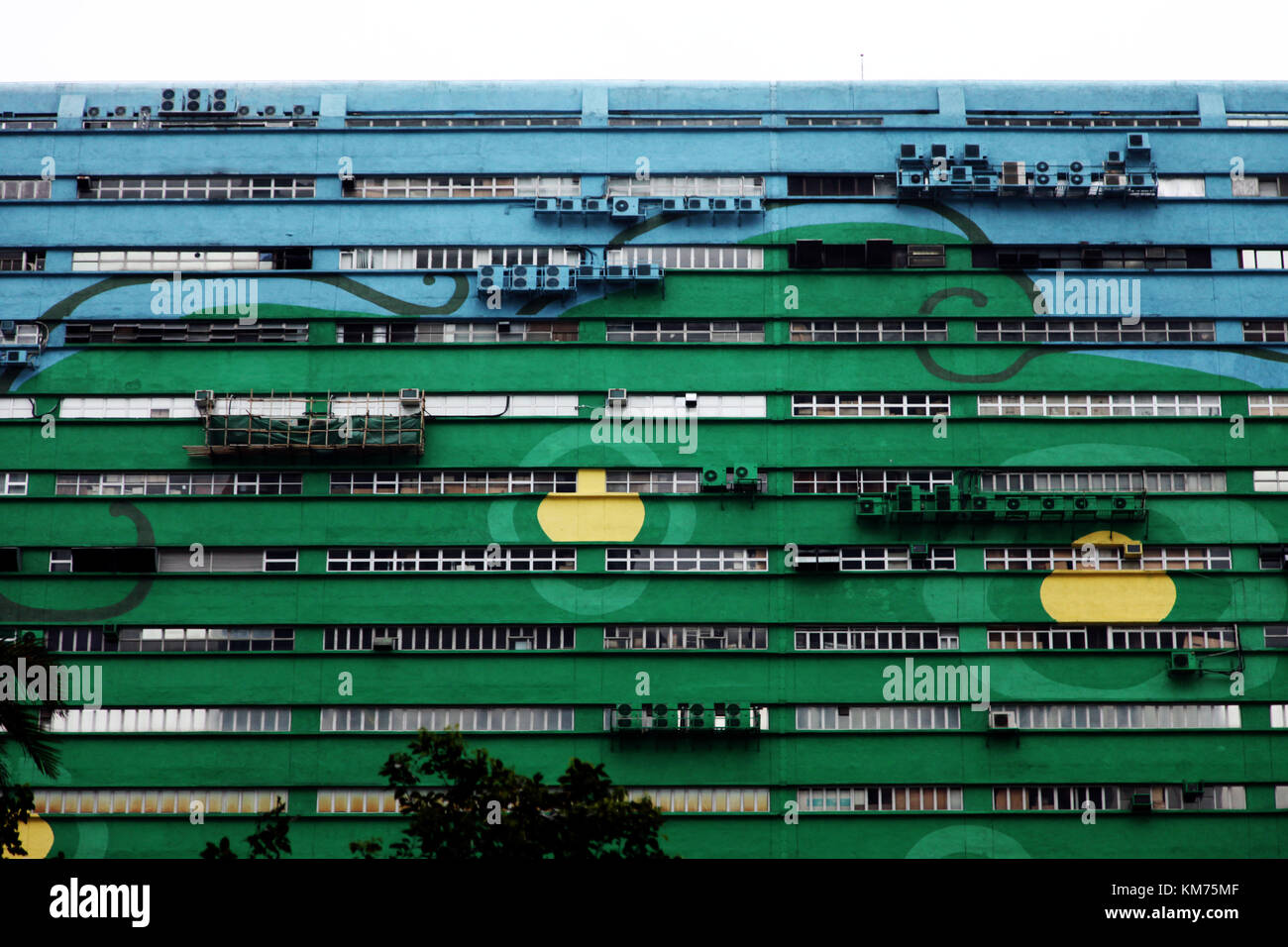 front of a building in hong kong in a green and blue color Stock Photo