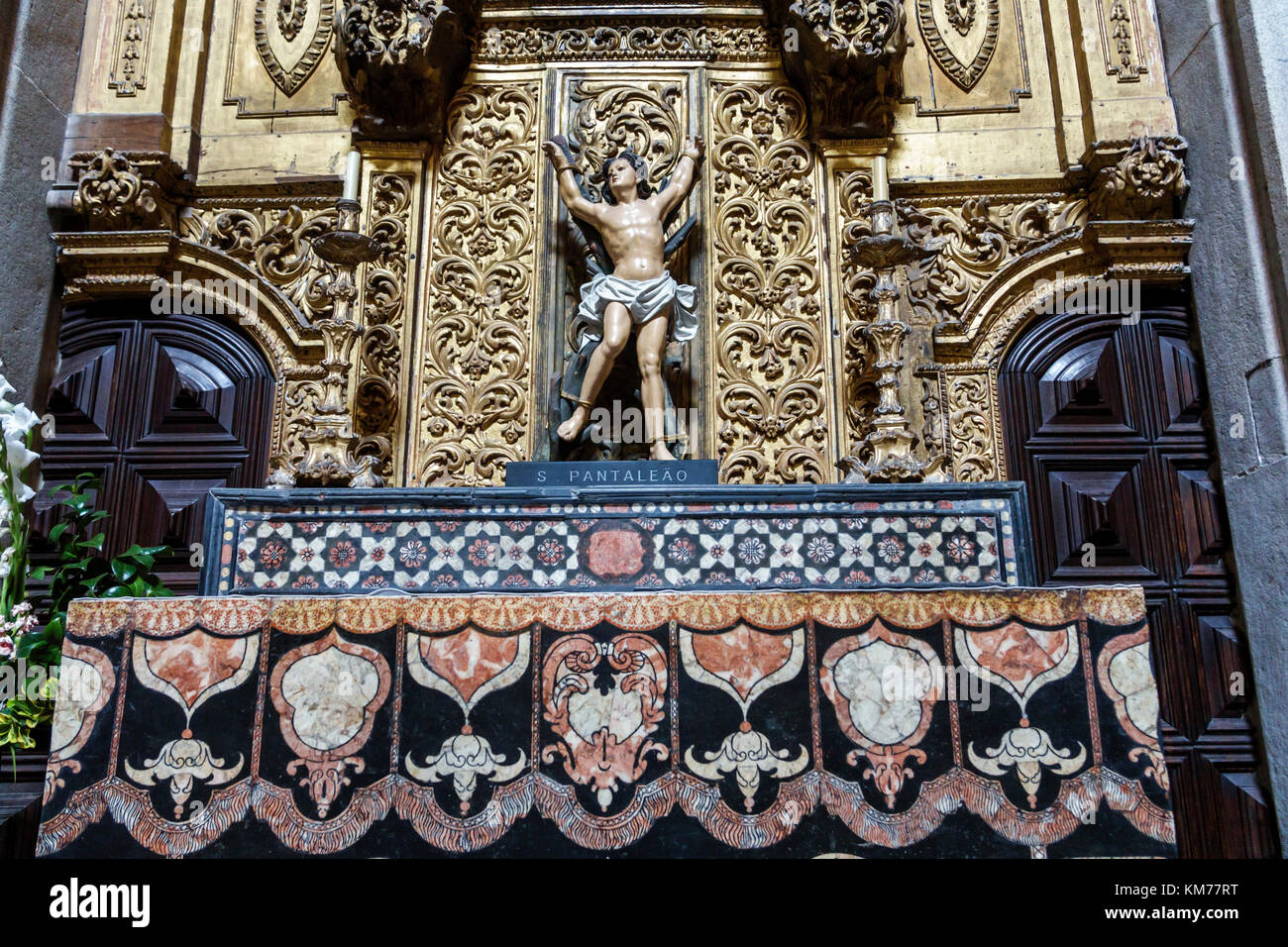 Porto Portugal,historic center,Se do Porto,Porto Cathedral,Roman Catholic church,interior inside,altar,religious statue,Saint Pantaleon,Hispanic,immig Stock Photo