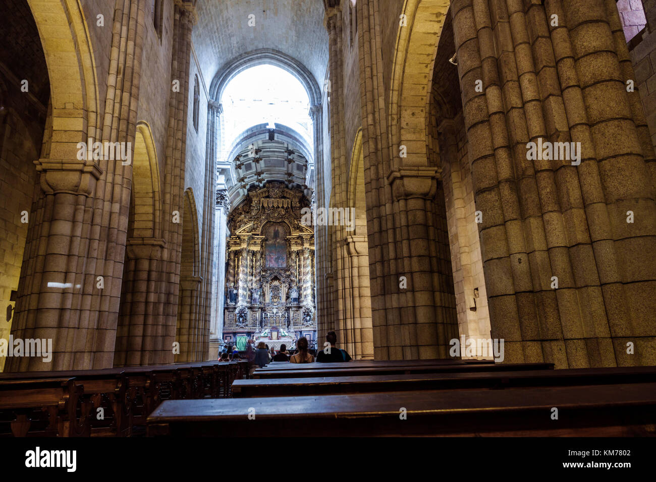 Porto Portugal,historic center,Se do Porto,Porto Cathedral,Roman Catholic church,interior inside,nave,central aisle,altar,pews,vaulted ceiling,Romanes Stock Photo