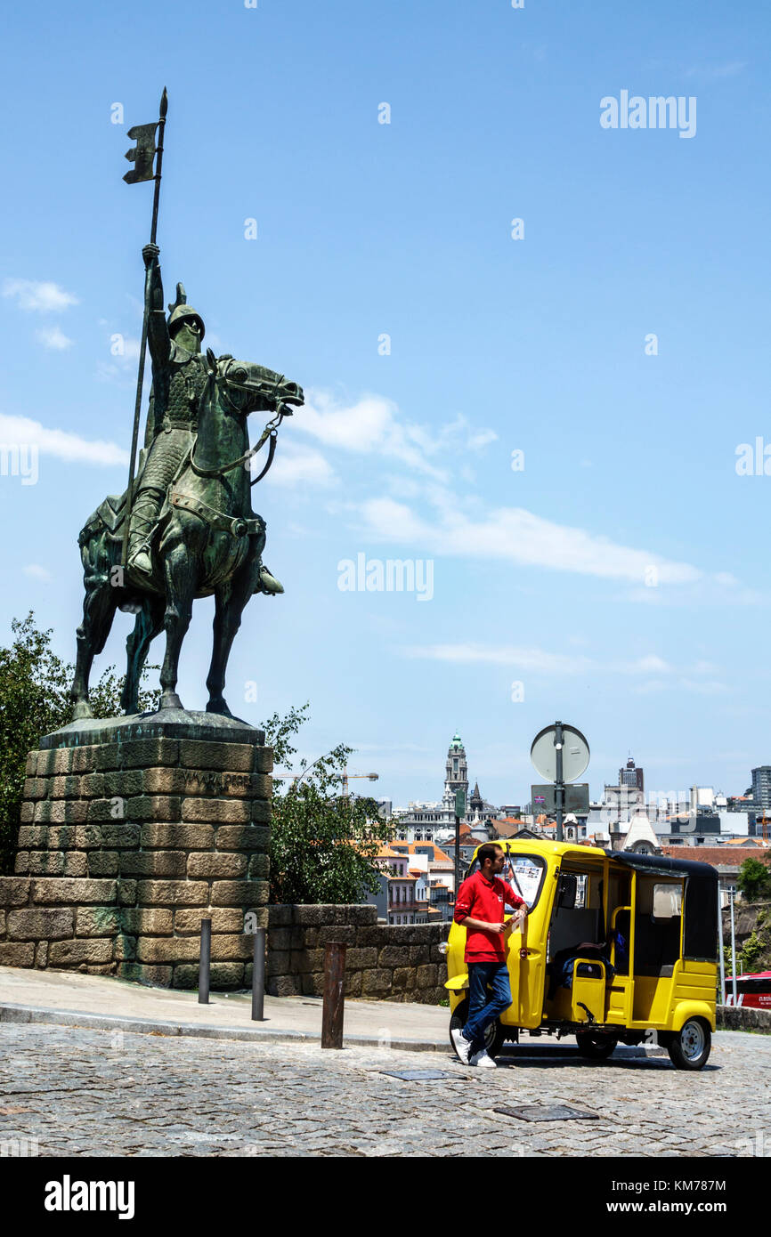Porto Portugal,historic center,Se do Porto,Porto Cathedral,equestrian statue,Vimara Peres,Christian knight,armor,man men male,tuk tuk,tricycle taxi,au Stock Photo