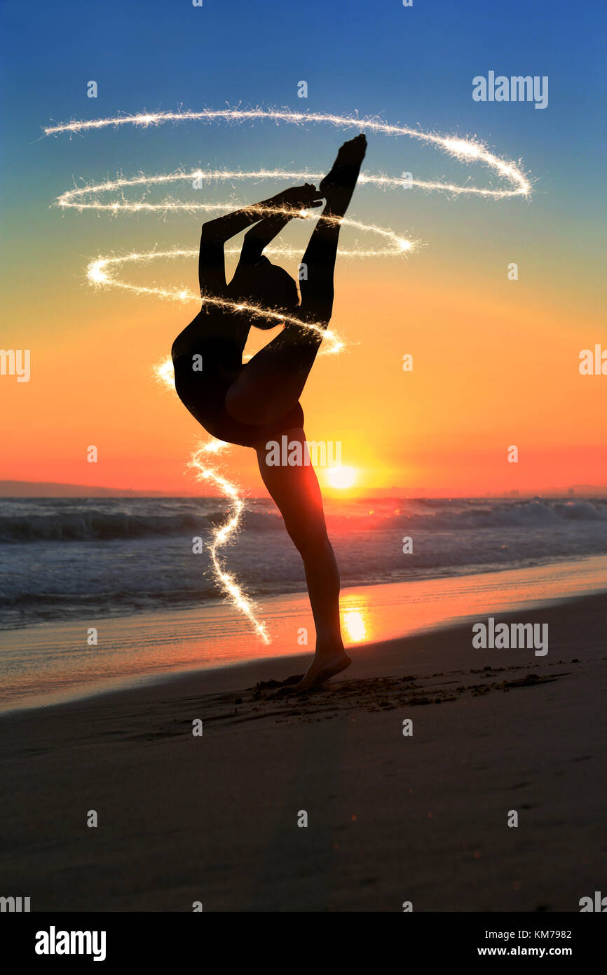 Beautiful Young Dancer at the Beach During Sunset Stock Photo - Alamy