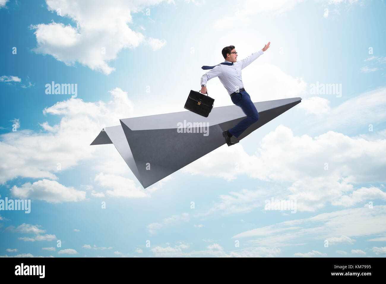Businessman flying on paper plane in business concept Stock Photo - Alamy