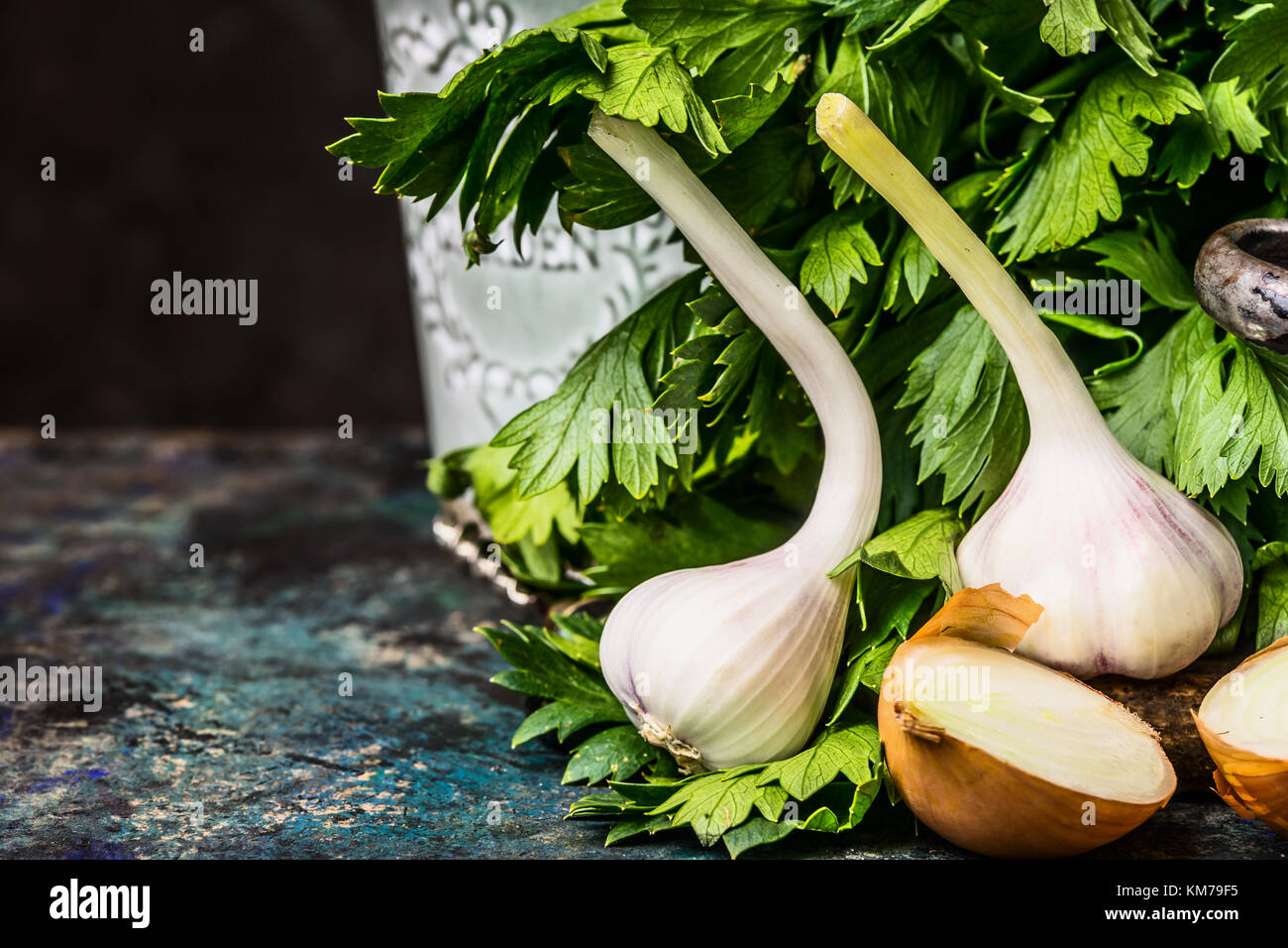 Fresh garlic on rustic wooden table at dark background, front view. Spicy Cooking concept Stock Photo
