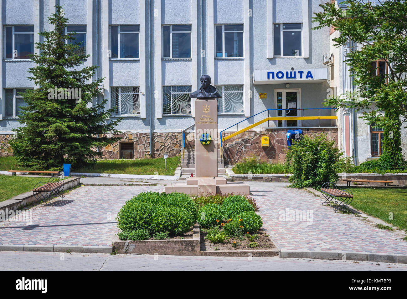 Stepan Bandera monument in front of Post Office in Chortkiv city in Ternopil Oblast of western Ukraine Stock Photo