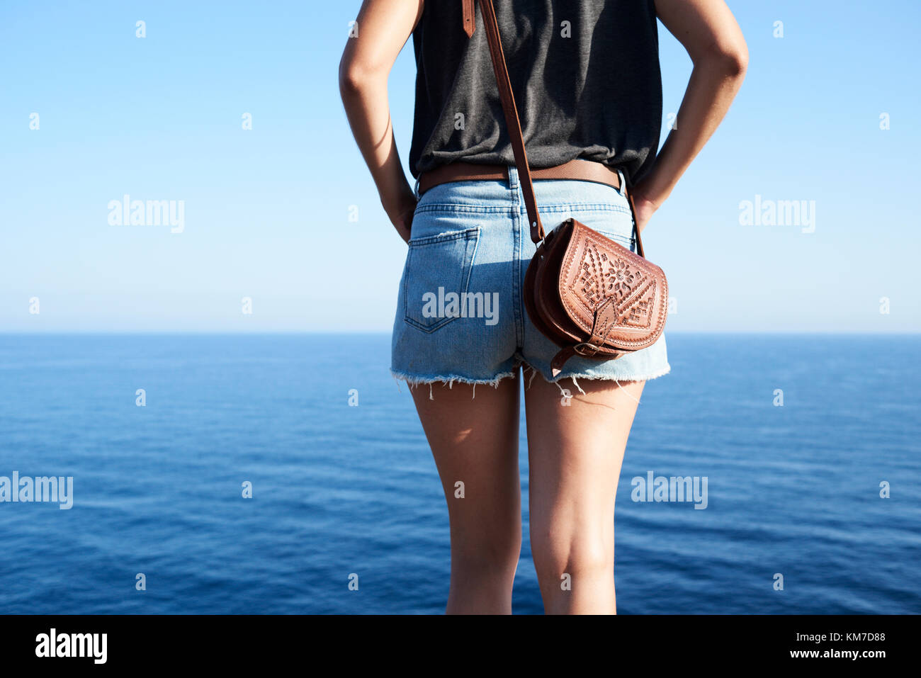 Menorca, Spain, solo traveler enjoying views in front of mediterranean sea, solo traveler Stock Photo