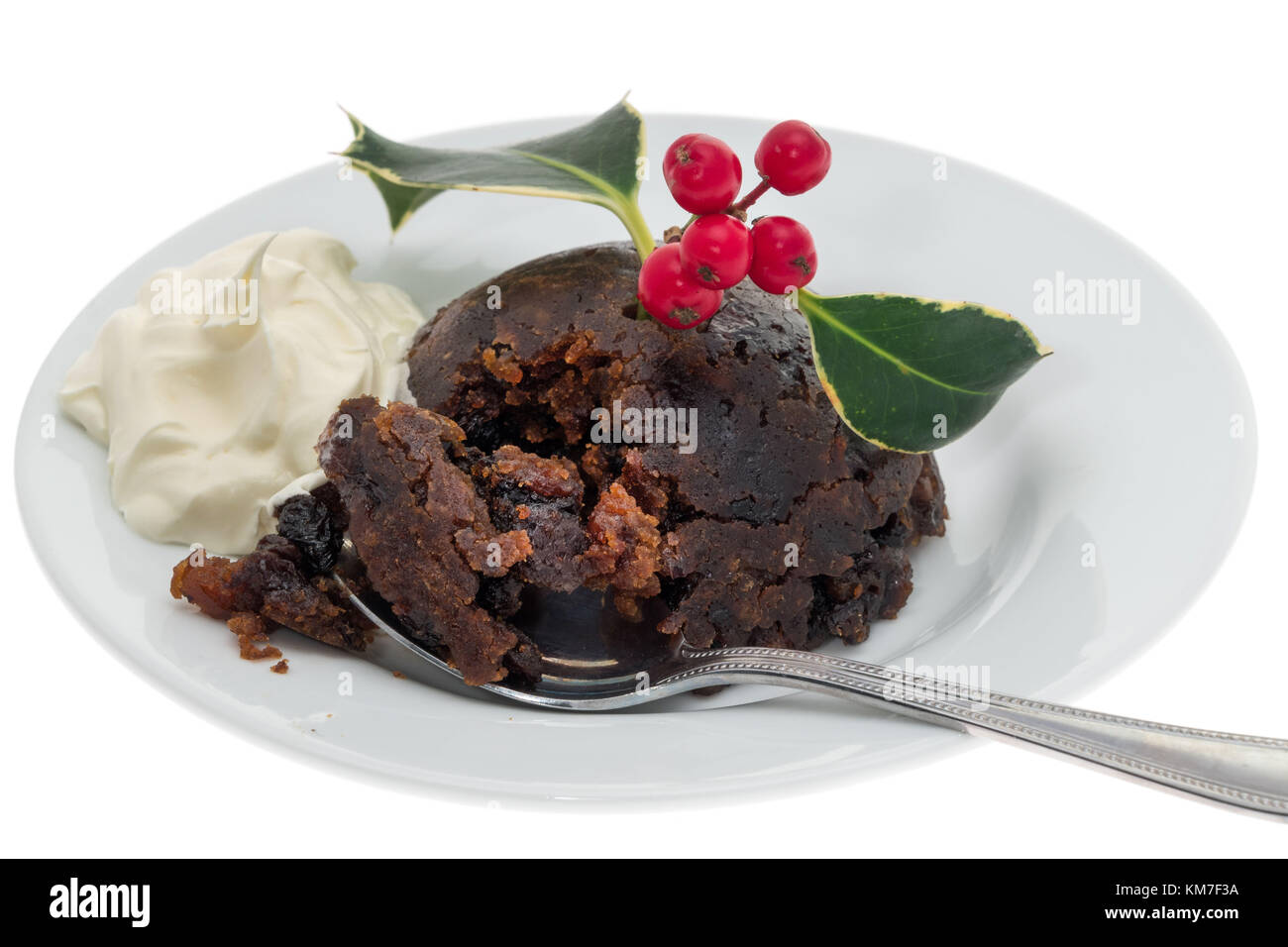 Christmas pudding with fresh cream Stock Photo Alamy