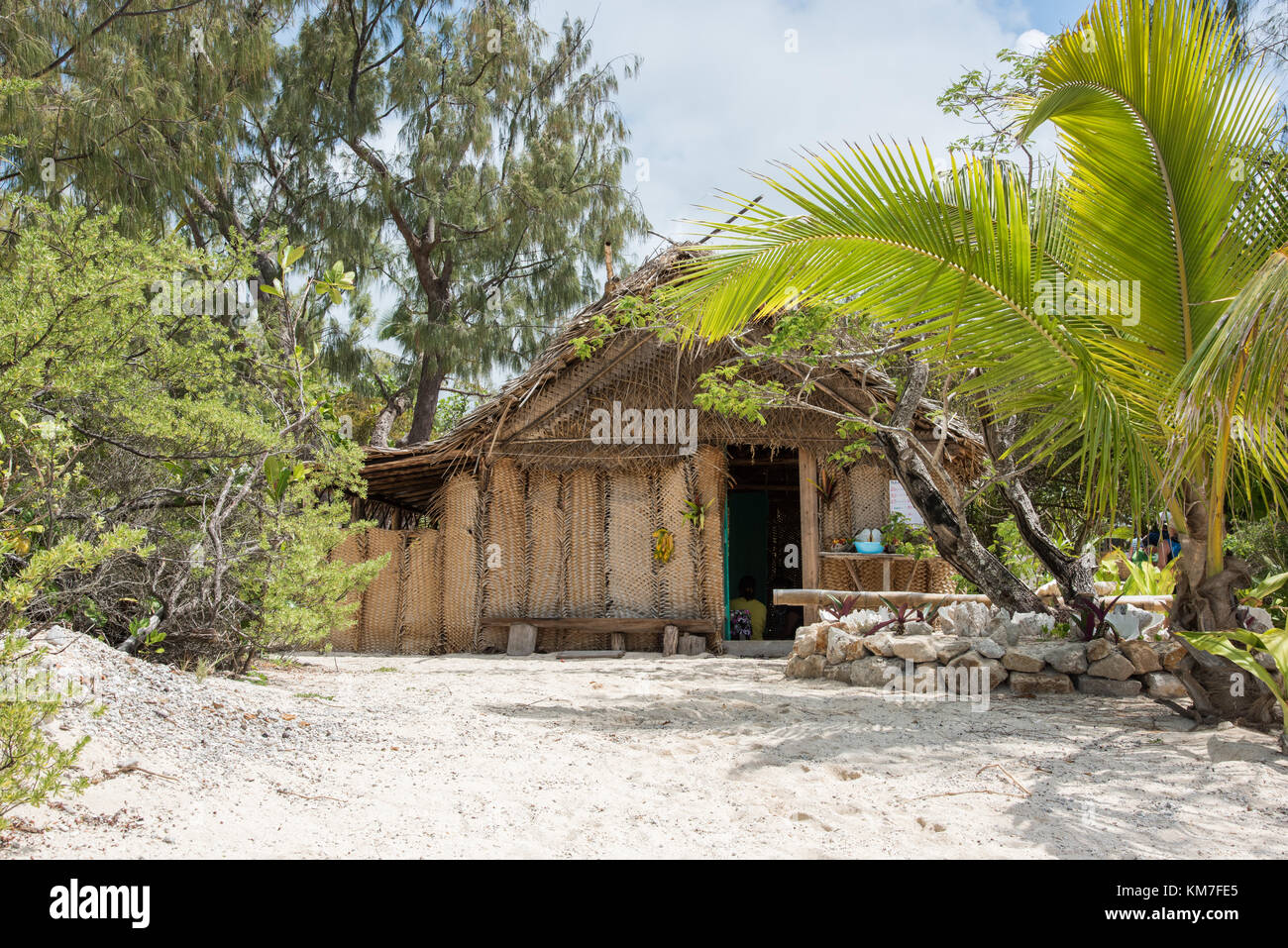 Mystery Island, Vanuatu-December 2,2016: Rustic architecture with thatched roof and tropical flora on Mystery Island, Vanuatu Stock Photo