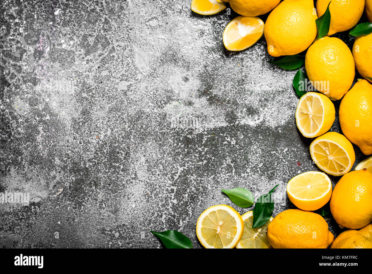Fresh ripe lemons. On a rustic background Stock Photo - Alamy