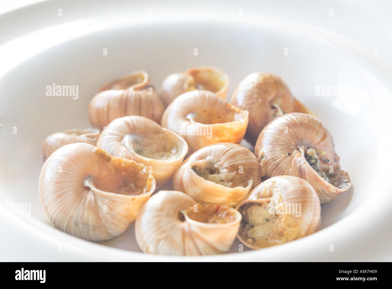 Portion of cooked snails Stock Photo Alamy