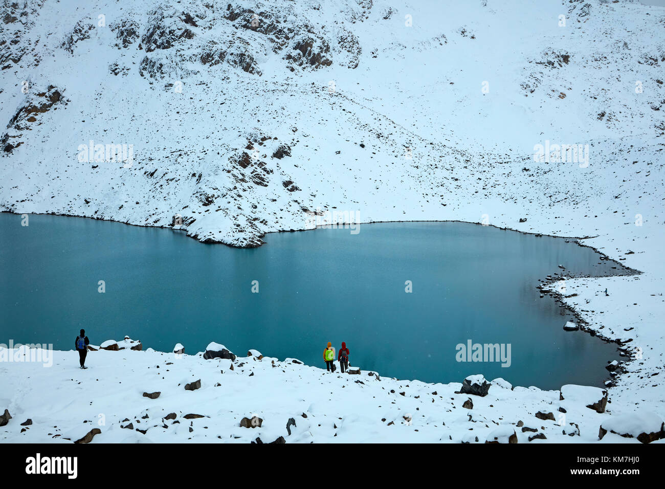 Hikers in snow at Laguna de los Tres, Parque Nacional Los Glaciares (World Heritage Area), Patagonia, Argentina, South America (MR) Stock Photo