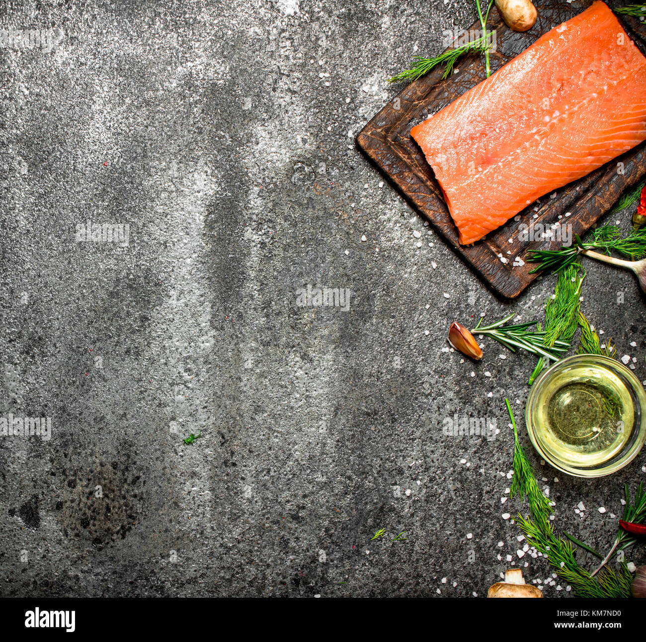 Raw fish. Salmon fillet with herbs and spices. On rustic background ...