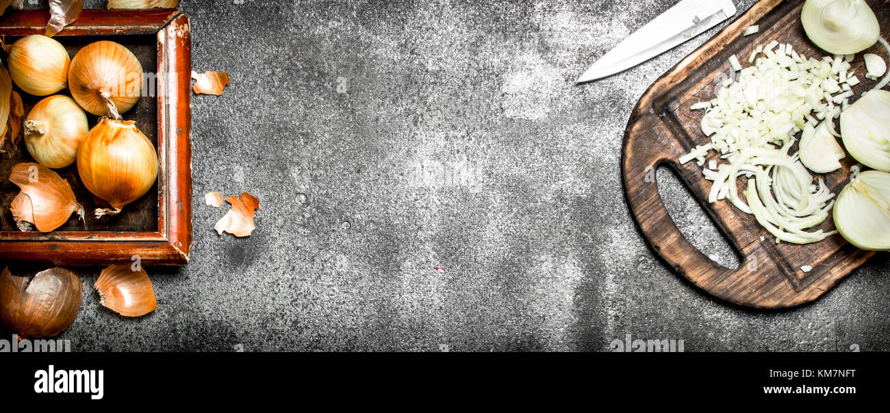 Fresh chopped onion on the old Board. On rustic background Stock Photo ...