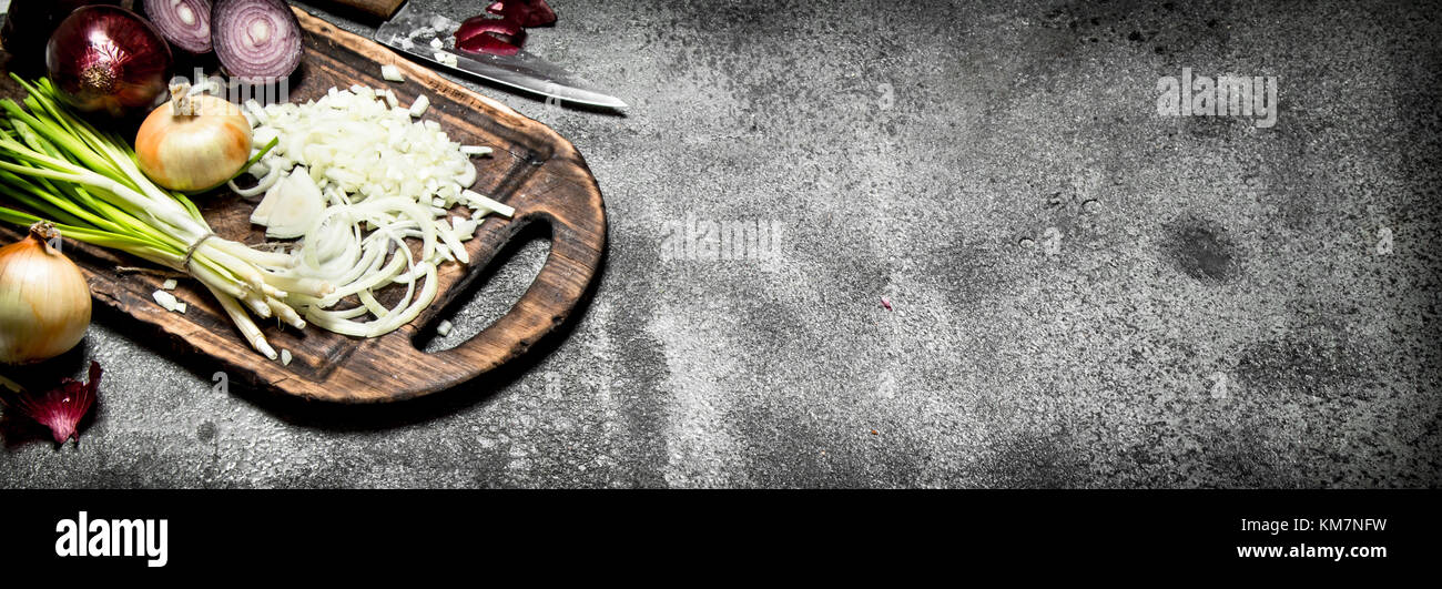 Fresh chopped onion on the old Board. On rustic background Stock Photo ...