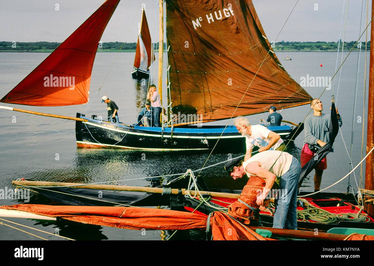 County Galway, Ireland. Traditional red sails fishing boats known as a Galway Bay hooker. Annual sailing festival at Kinvara Stock Photo