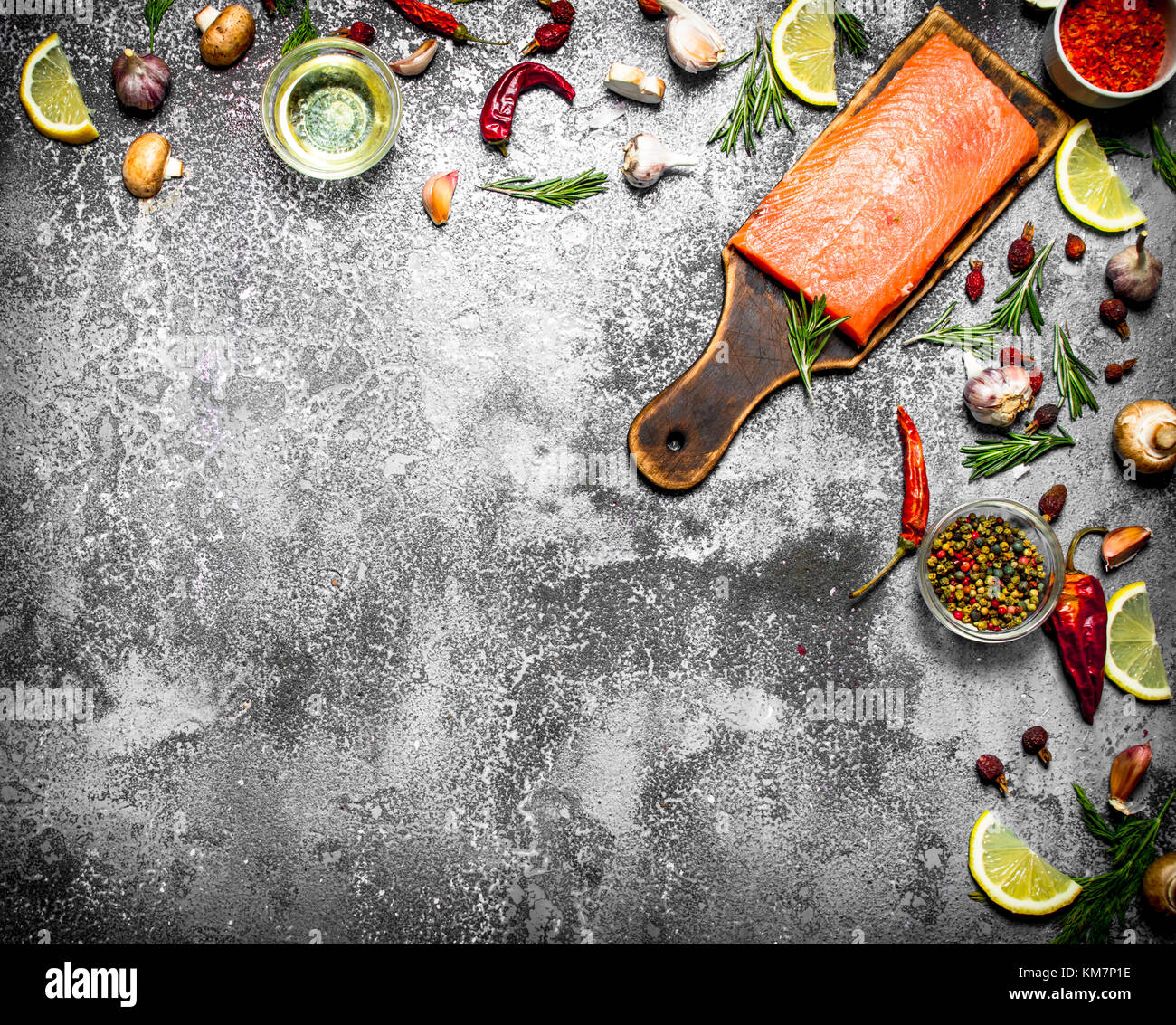 Raw fish. Fresh salmon fillet with herbs and spices. On rustic ...