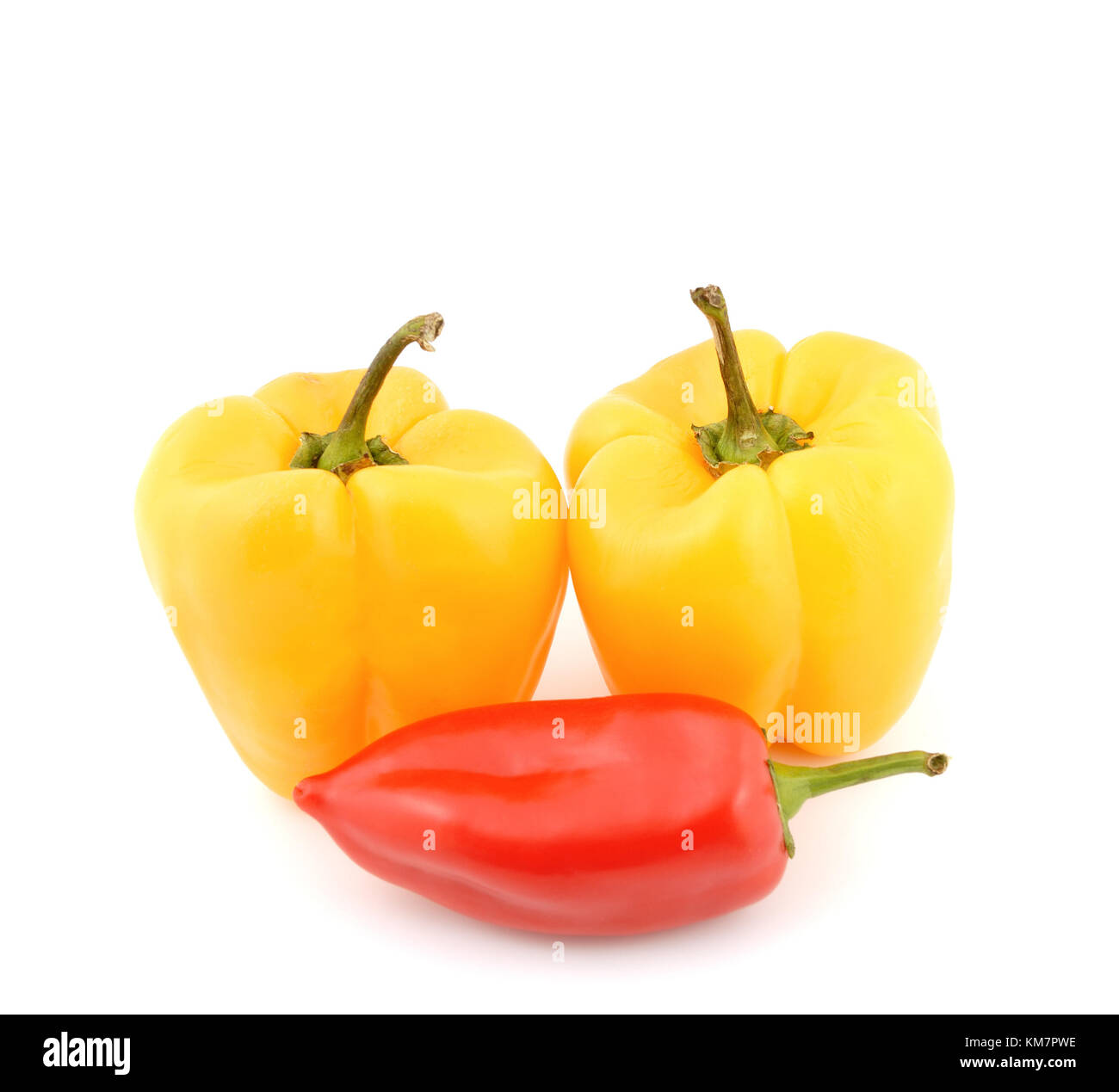 Red and yellow sweet peppers on a white background Stock Photo - Alamy