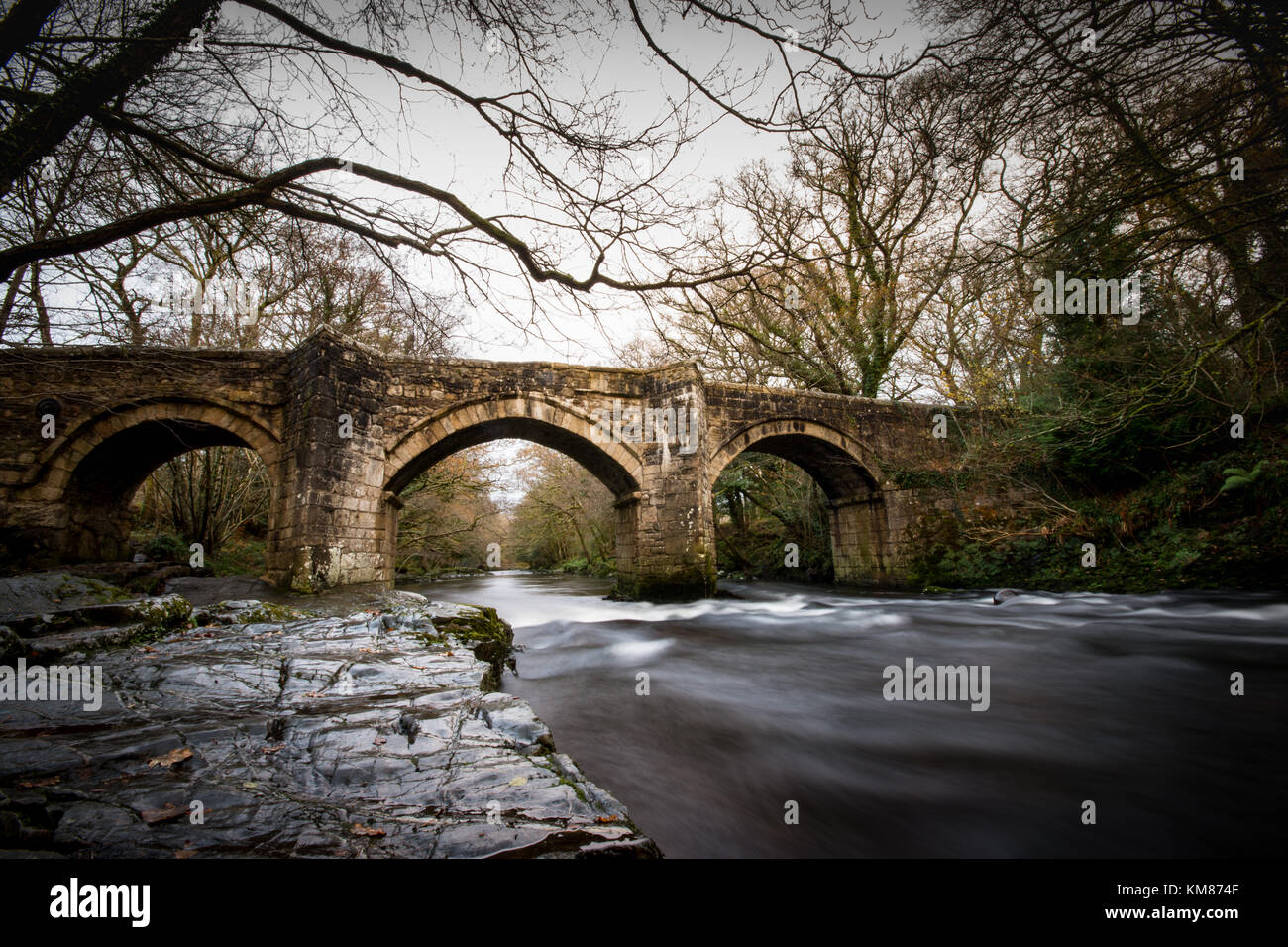 Motion blur shot of New bridge over the river dart, dartmoor Stock Photo