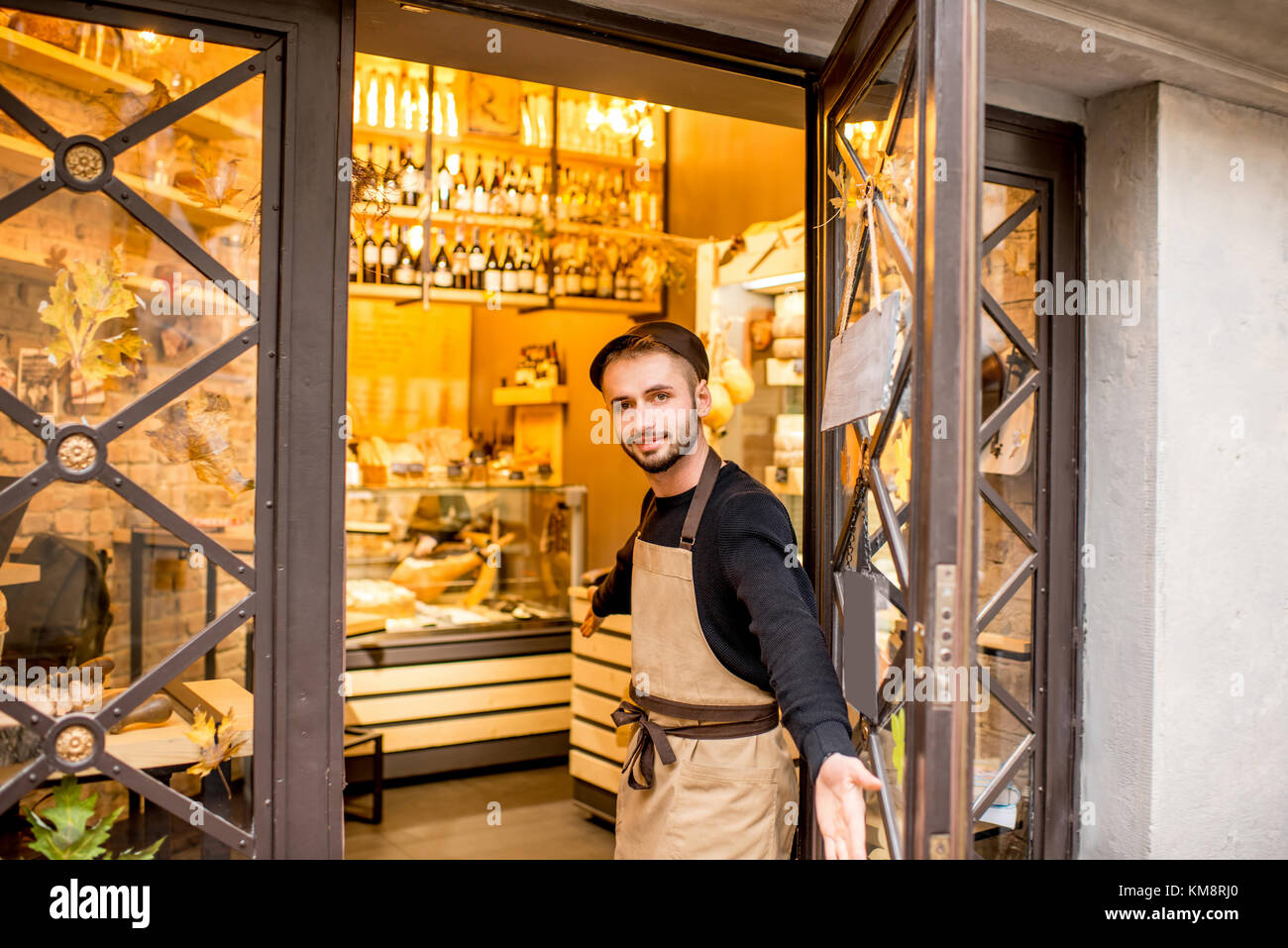 Portrait of a salesman in uniform outdoors in front of the store