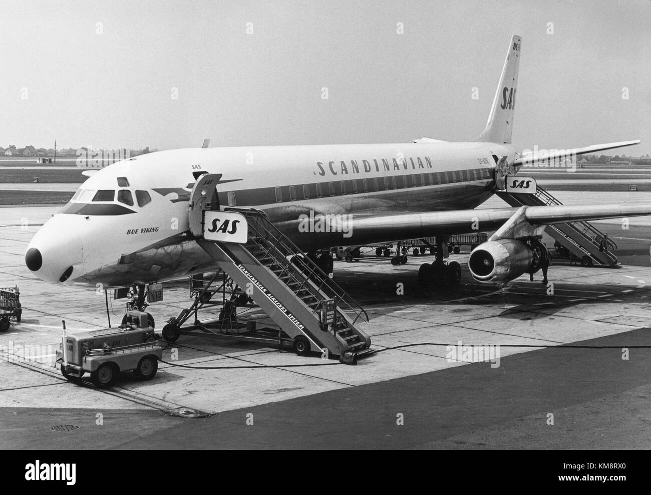 The SAS DC-8 33 aircraft, named Bue Viking, is seen at the airport. This model is a part of the Douglas DC-8 series, which was widely used by SAS for long-haul flights during the 1960s and 1970s. Stock Photo