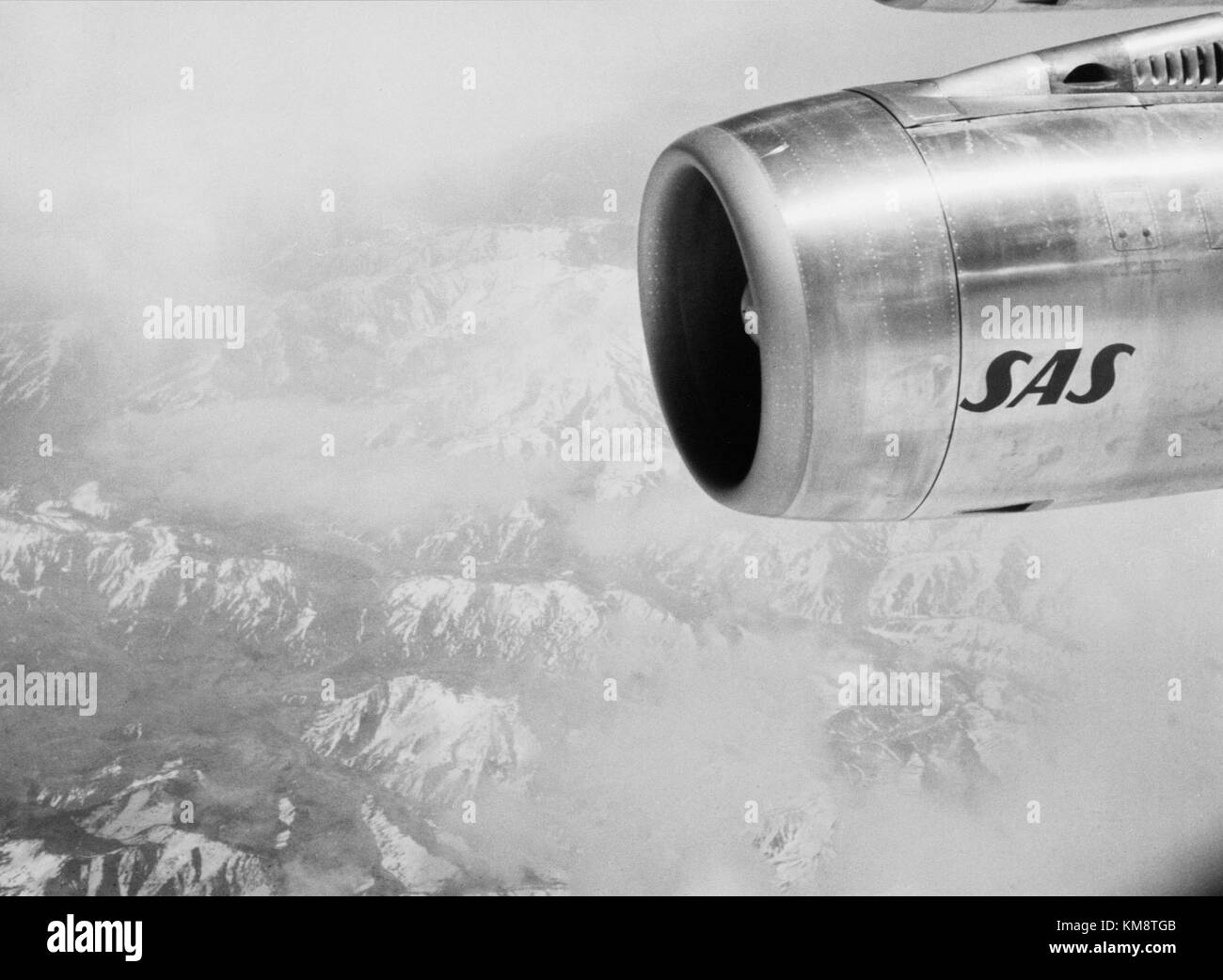 The SAS DC 8 62 aircraft engine, as seen in a 1967 flight over Uzbekistan, highlights the operational capabilities of the DC-8 series. The DC-8 was a key model in the history of commercial aviation, used widely by airlines around the world. Stock Photo