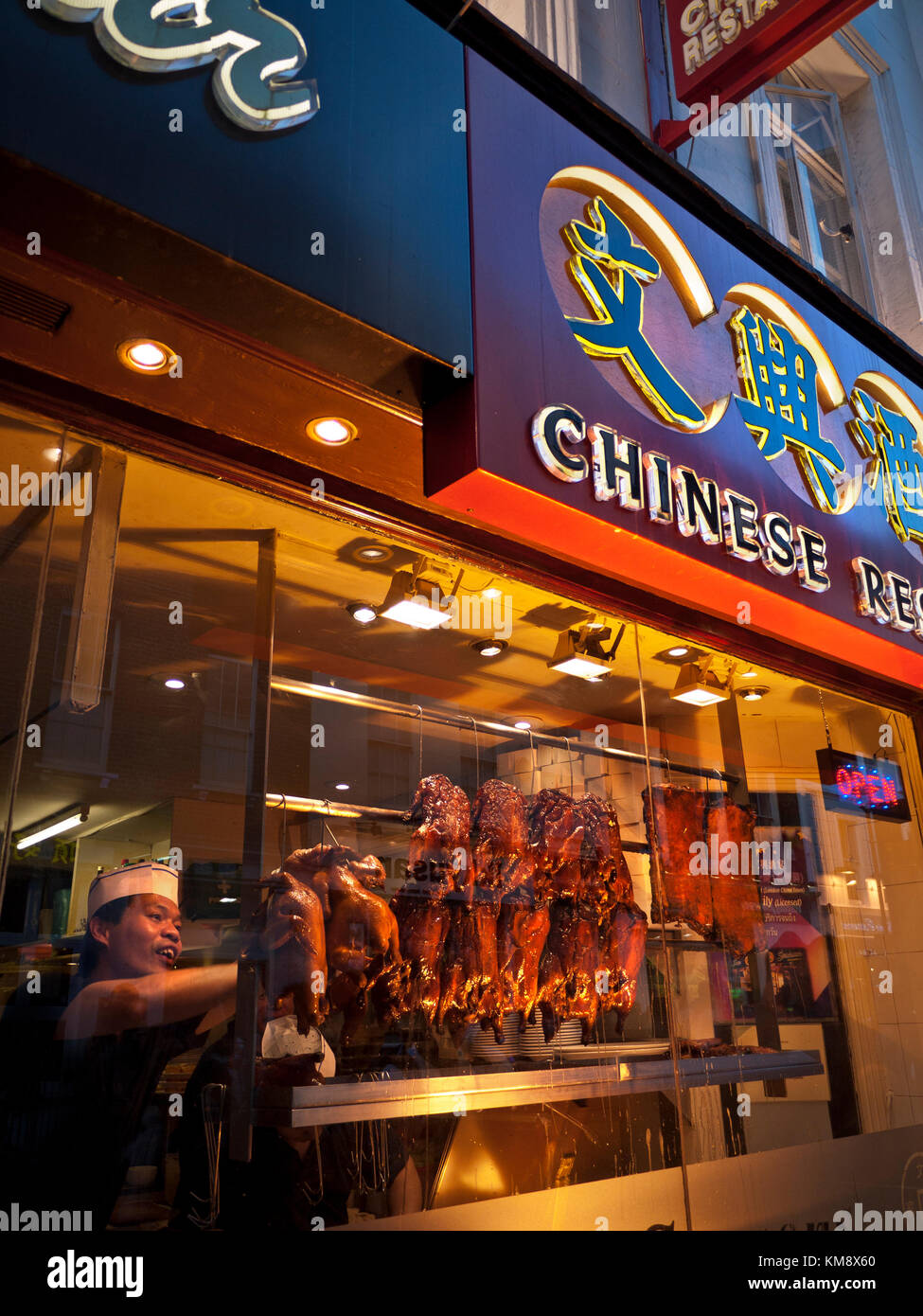 CRISPY DUCK CHINATOWN CHINA TOWN SOHO LONDON Chef arranging rows of